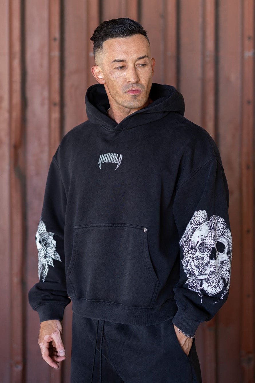 Front view of oversized hoodie men style with skull sleeve design, perfect for fall layering