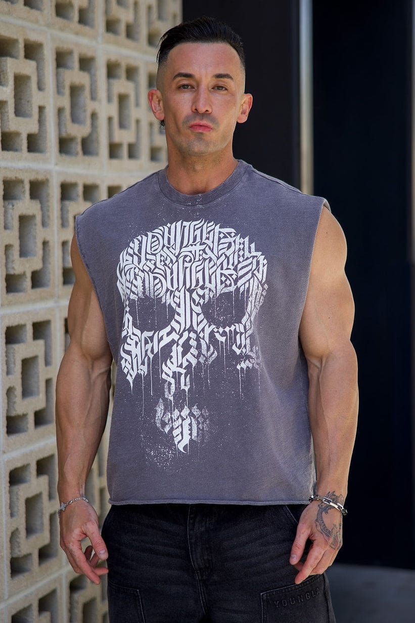 Male model wearing cut-off shirt layered over a tee for fall