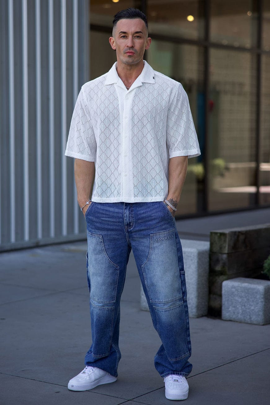 Front view of the crochet button-up shirt, ideal for summer parties.