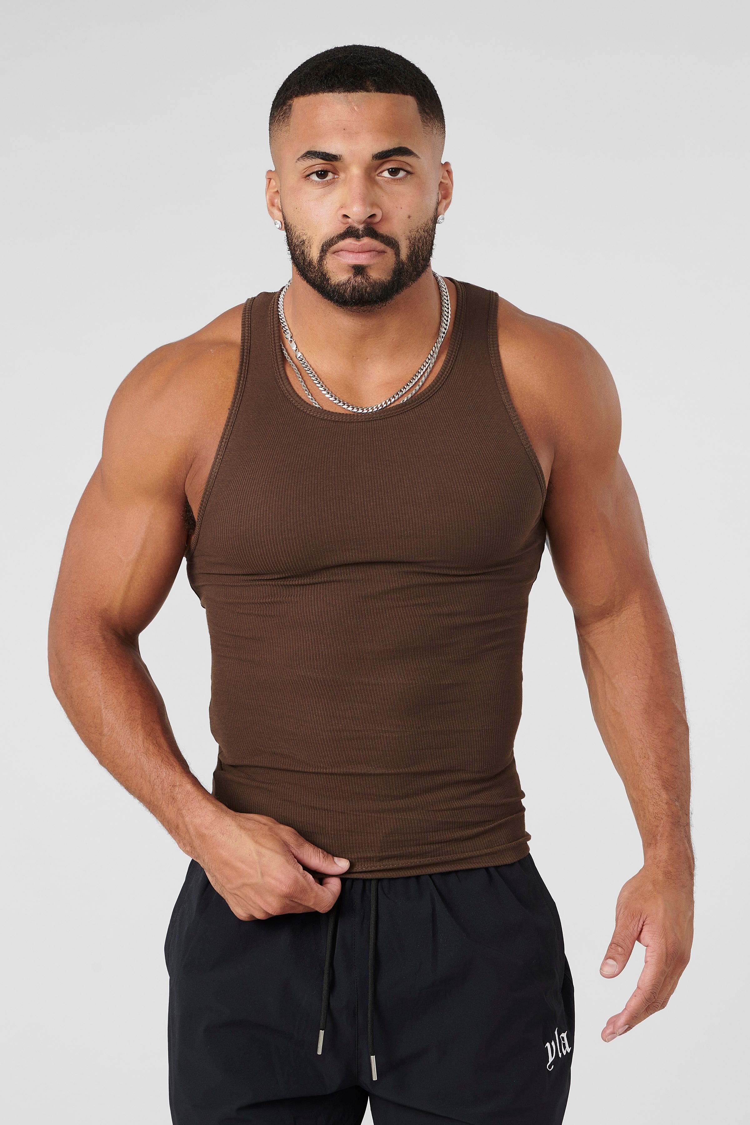 Folded black tank top from pack 1 – sleek gym-ready styling