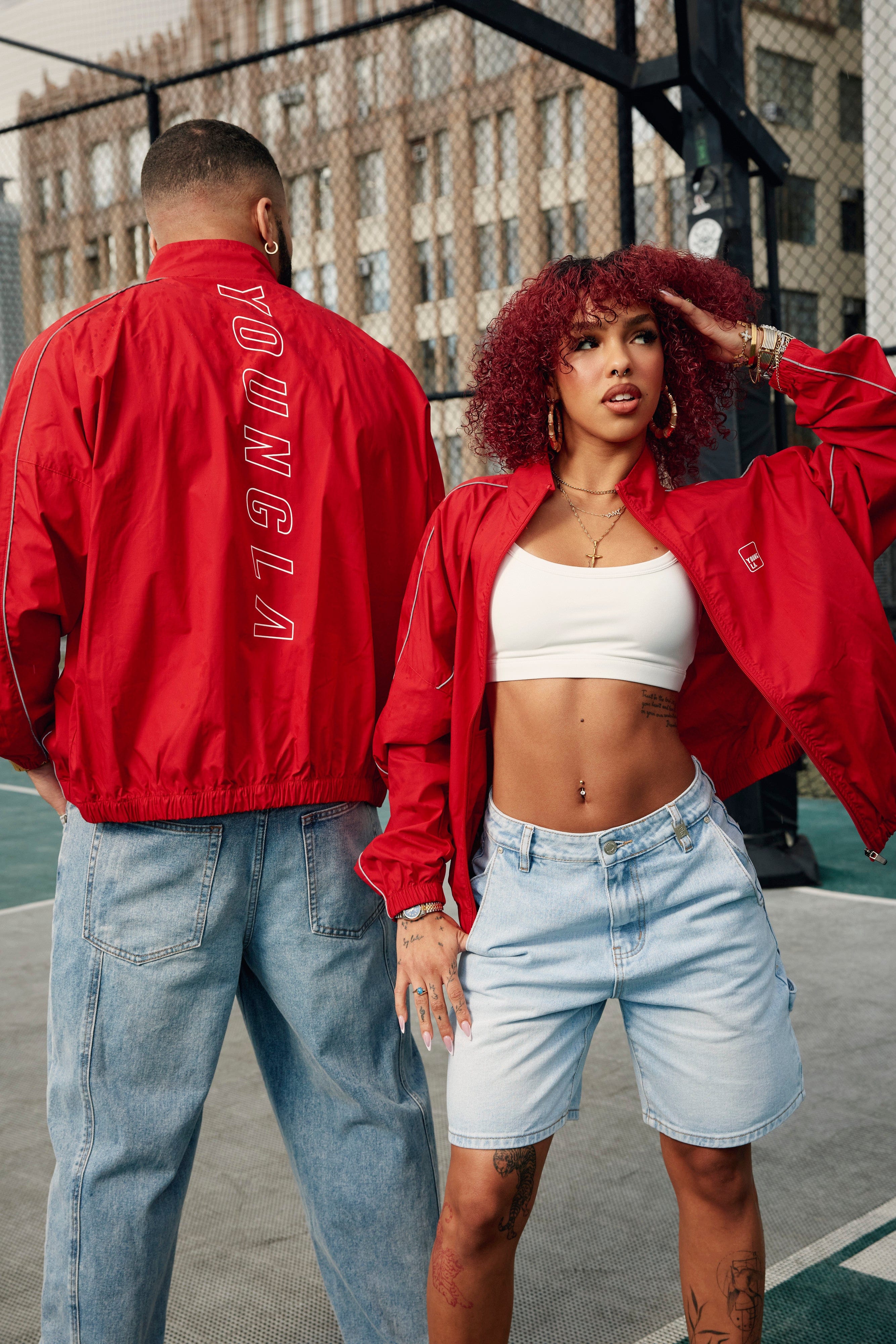 Model wearing the Flash Womens Windbreaker Jacket during an outdoor activity.