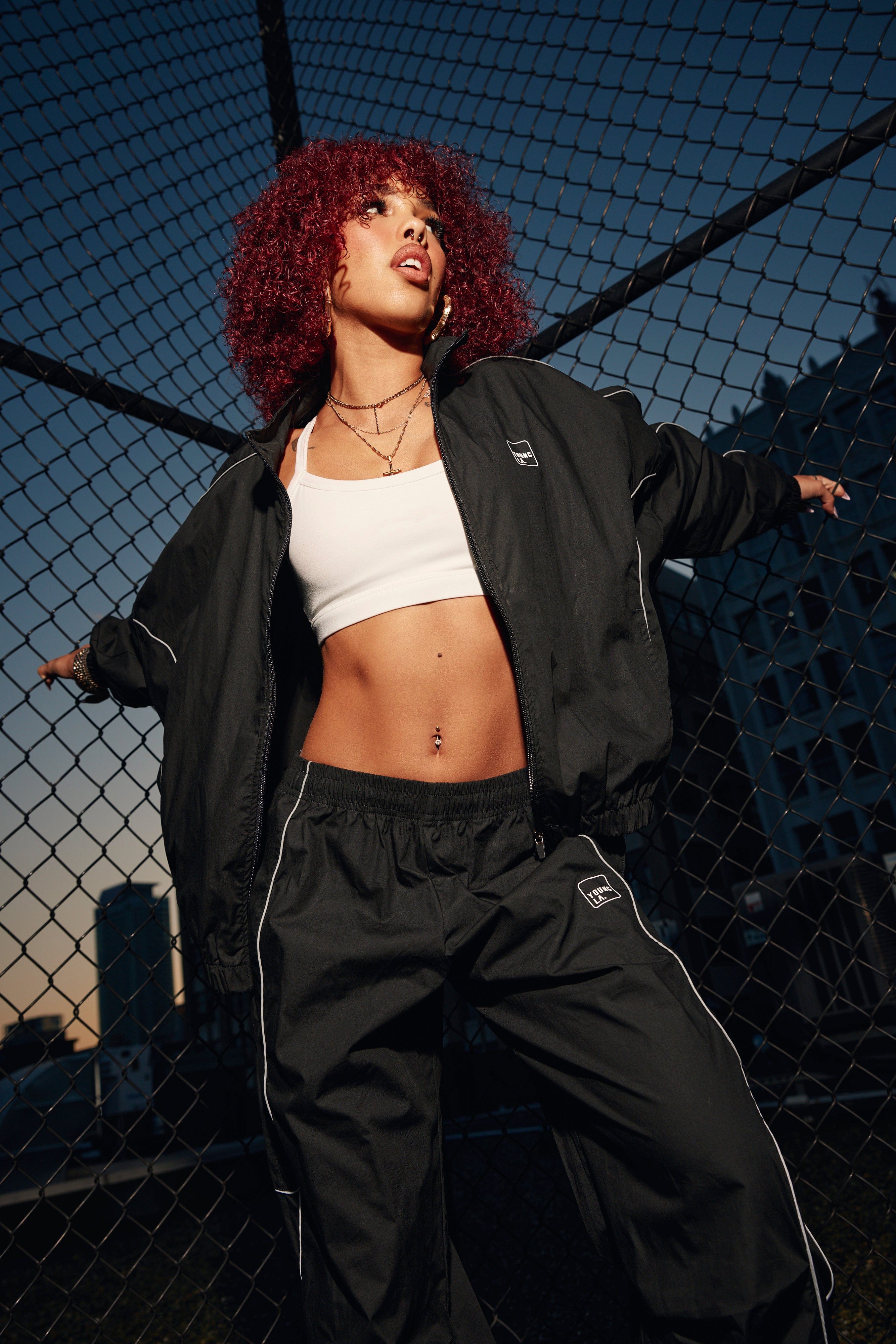Front view of the Flash Womens Windbreaker Jacket showcasing its sporty design.