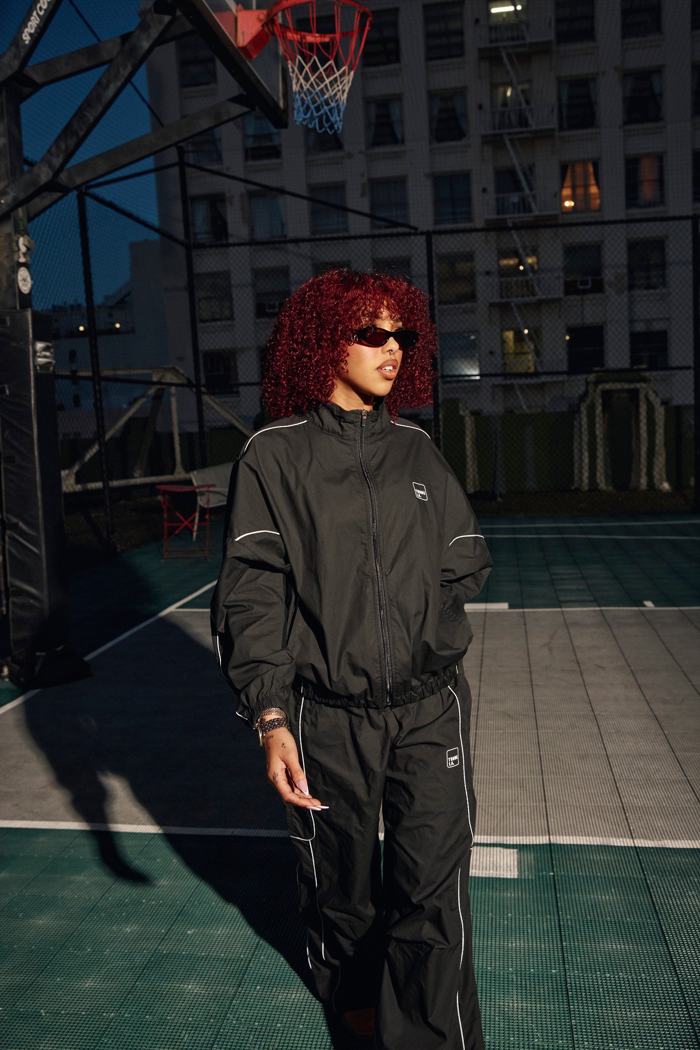 Front view of the Flash Womens Windbreaker Jacket showcasing its sporty design.