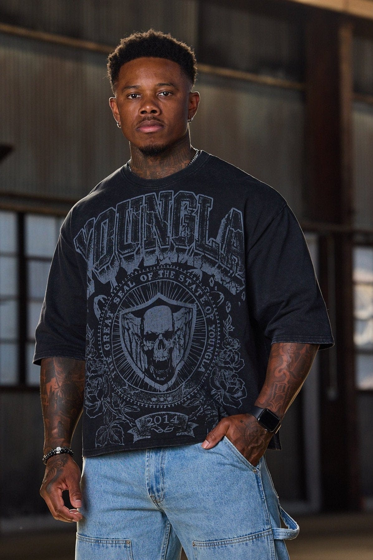 Side angle of mens acid wash tee highlighting cropped length