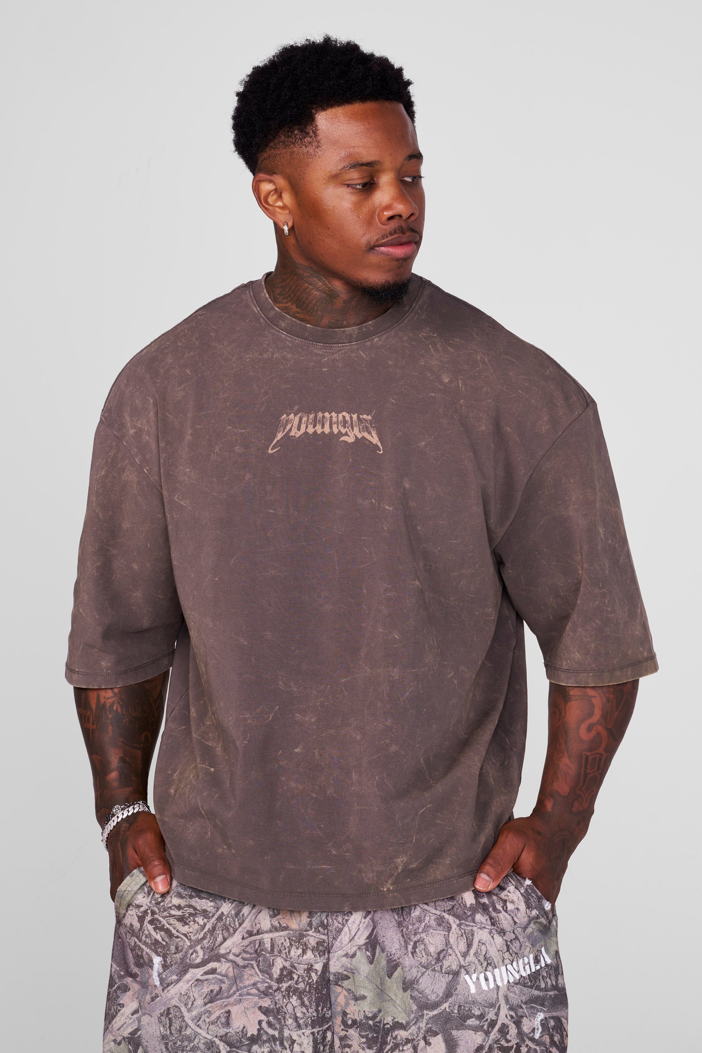 Close-up of vintage acid wash oversized t shirt fabric showing texture and design details