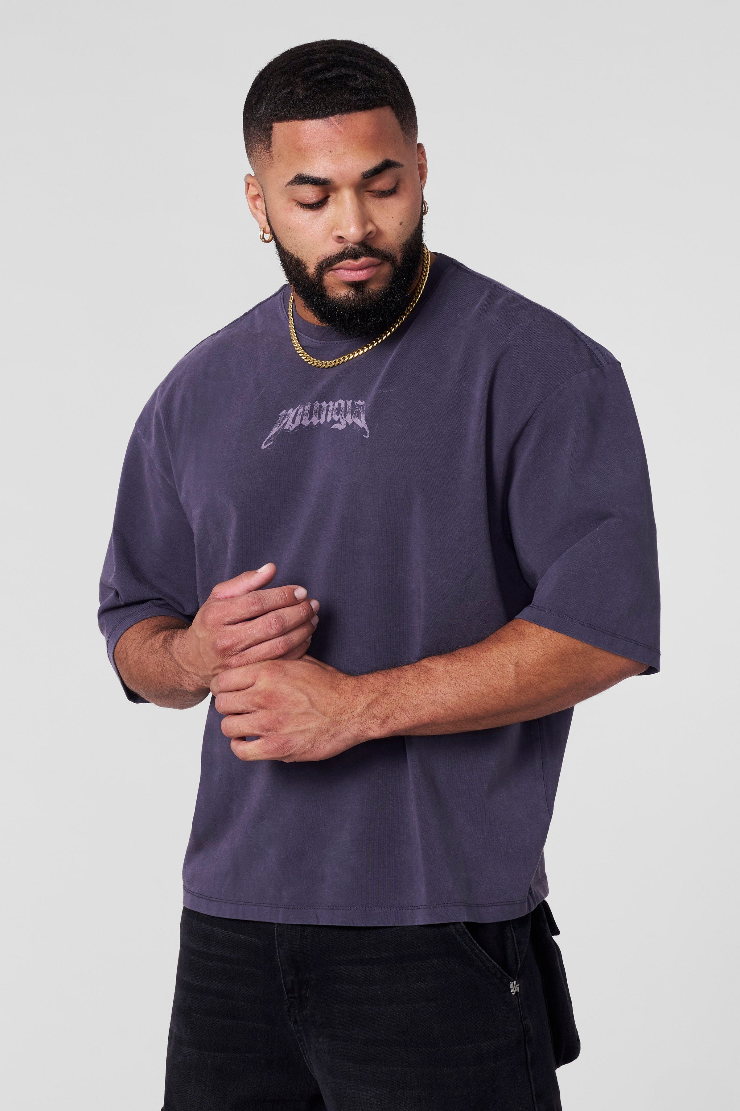 Front view of galaxy-themed oversized t shirt on a casual model
