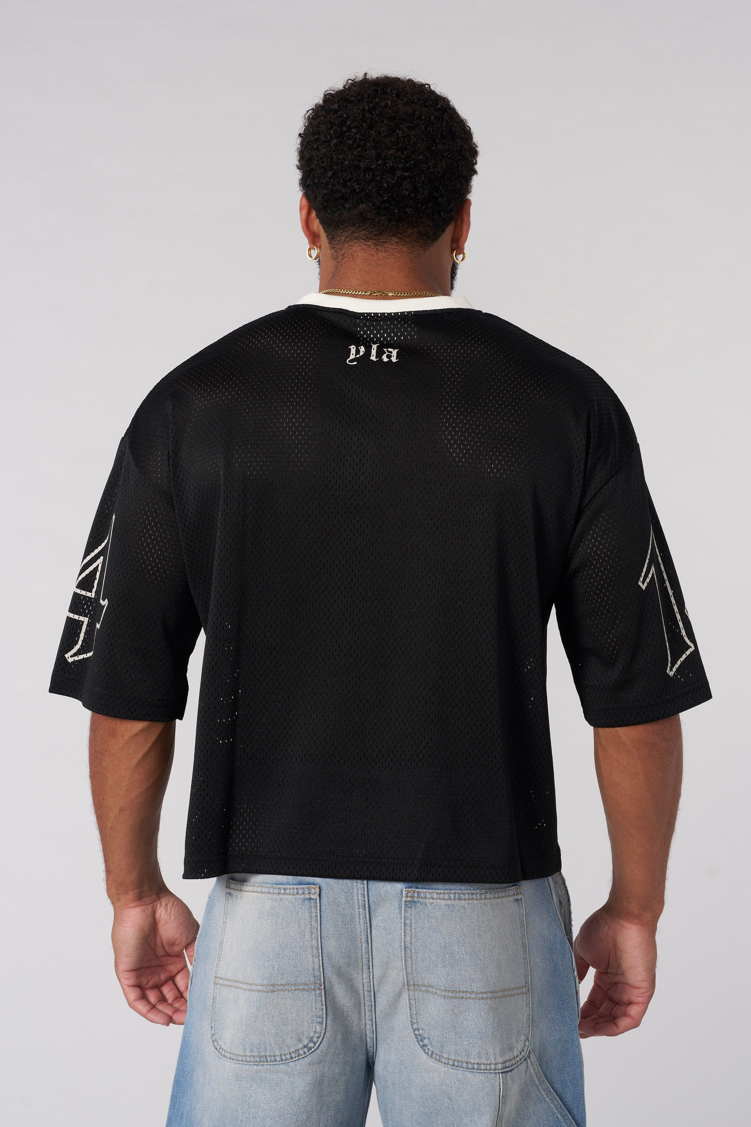 Close-up of the dripping skull graphic on the chest of the football jersey