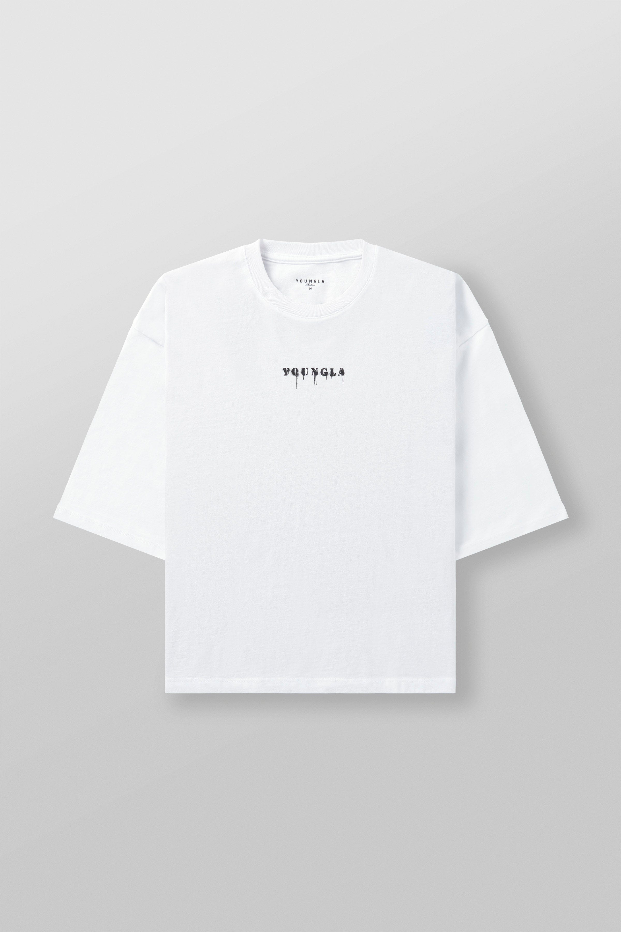 Model wearing loose fit cotton t-shirt with cropped length and minimalist logo