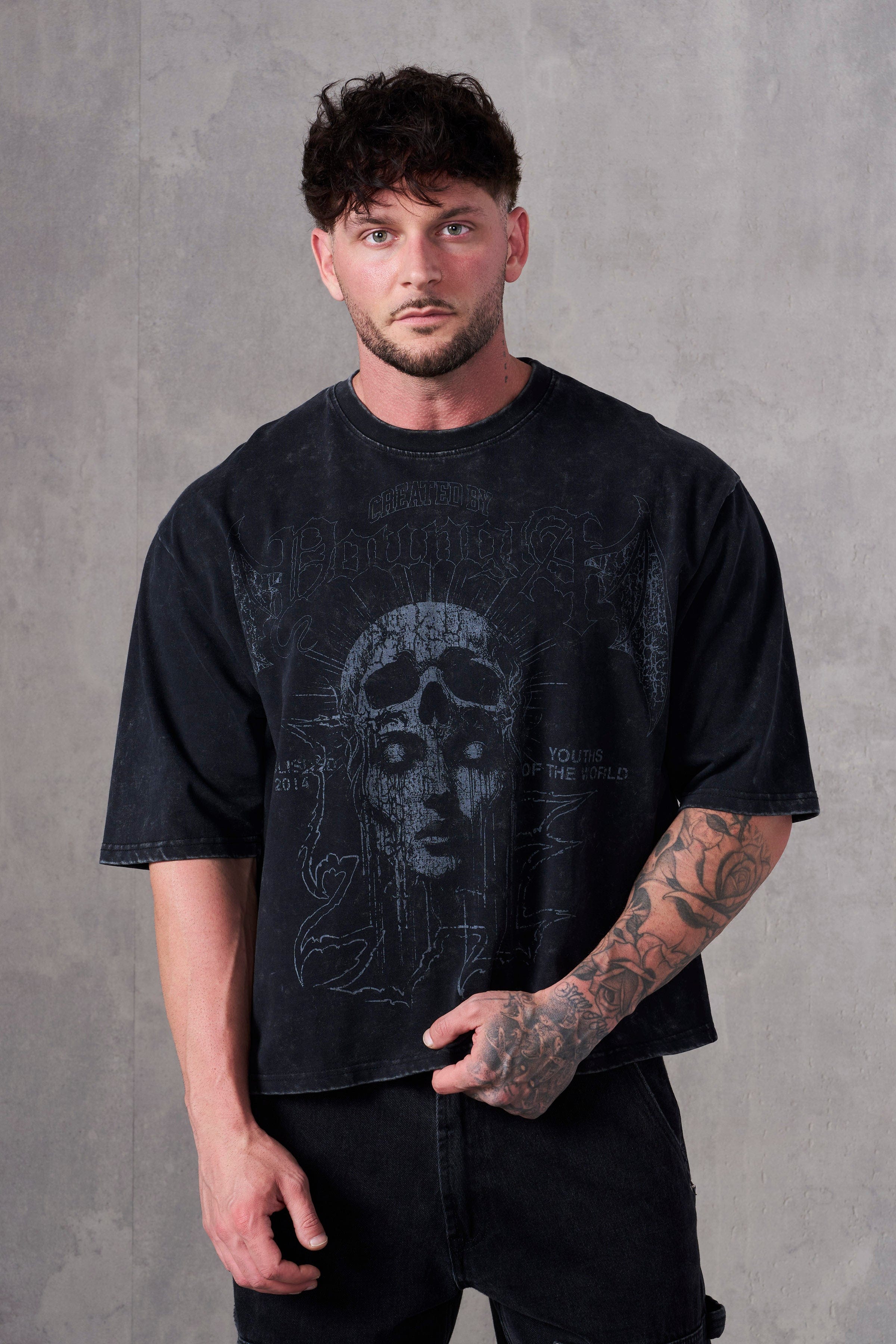 Side angle of mens acid wash tee highlighting cropped length