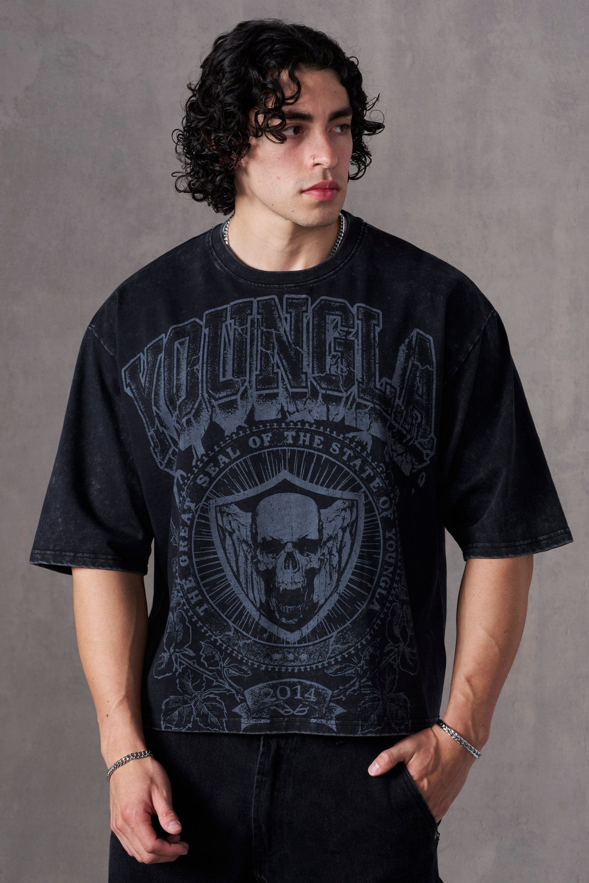 Front view of acid wash tee showing boxy fit and graphic design