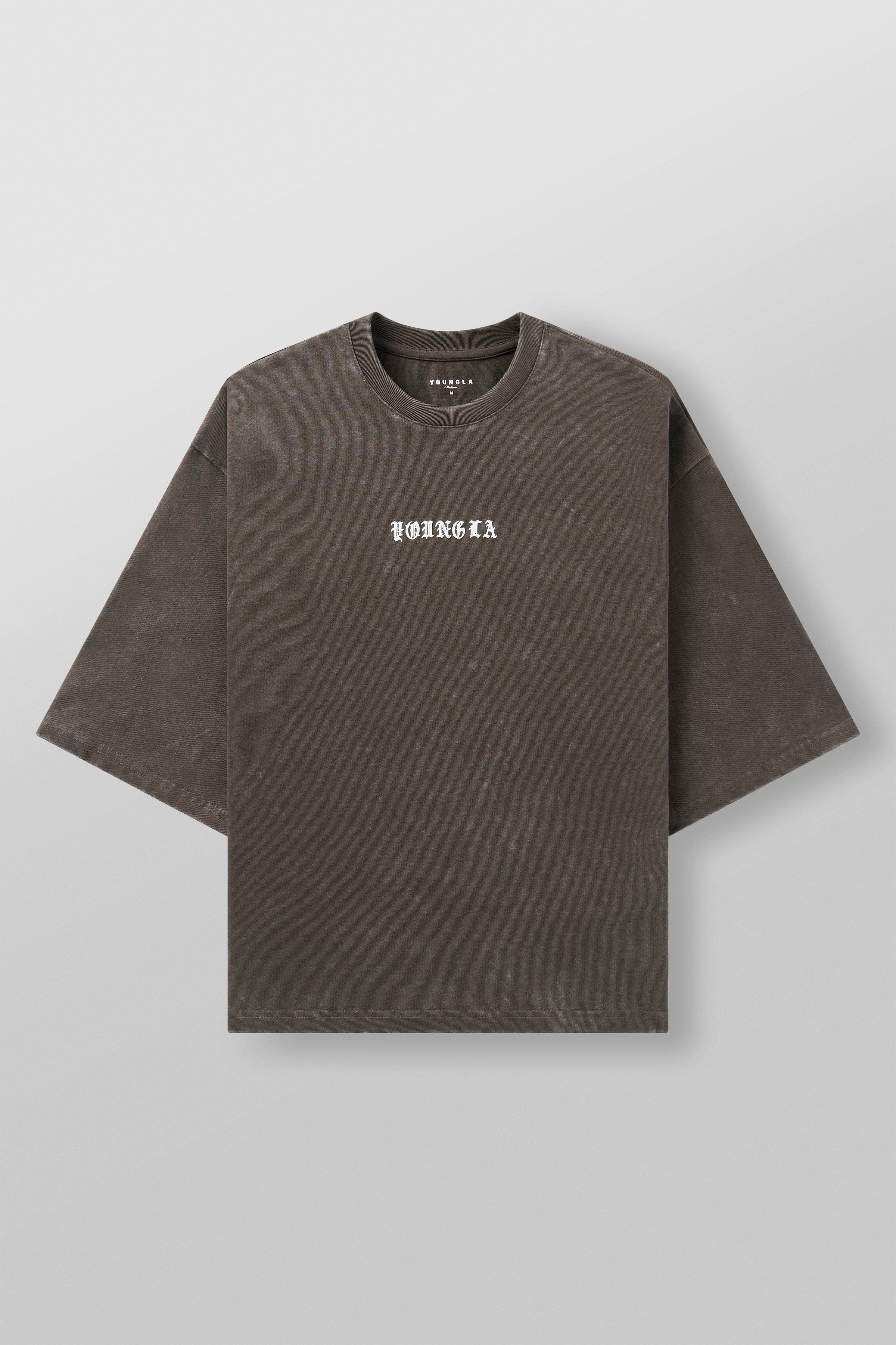Back view of model showcasing the cropped length of the boxy fit shirt
