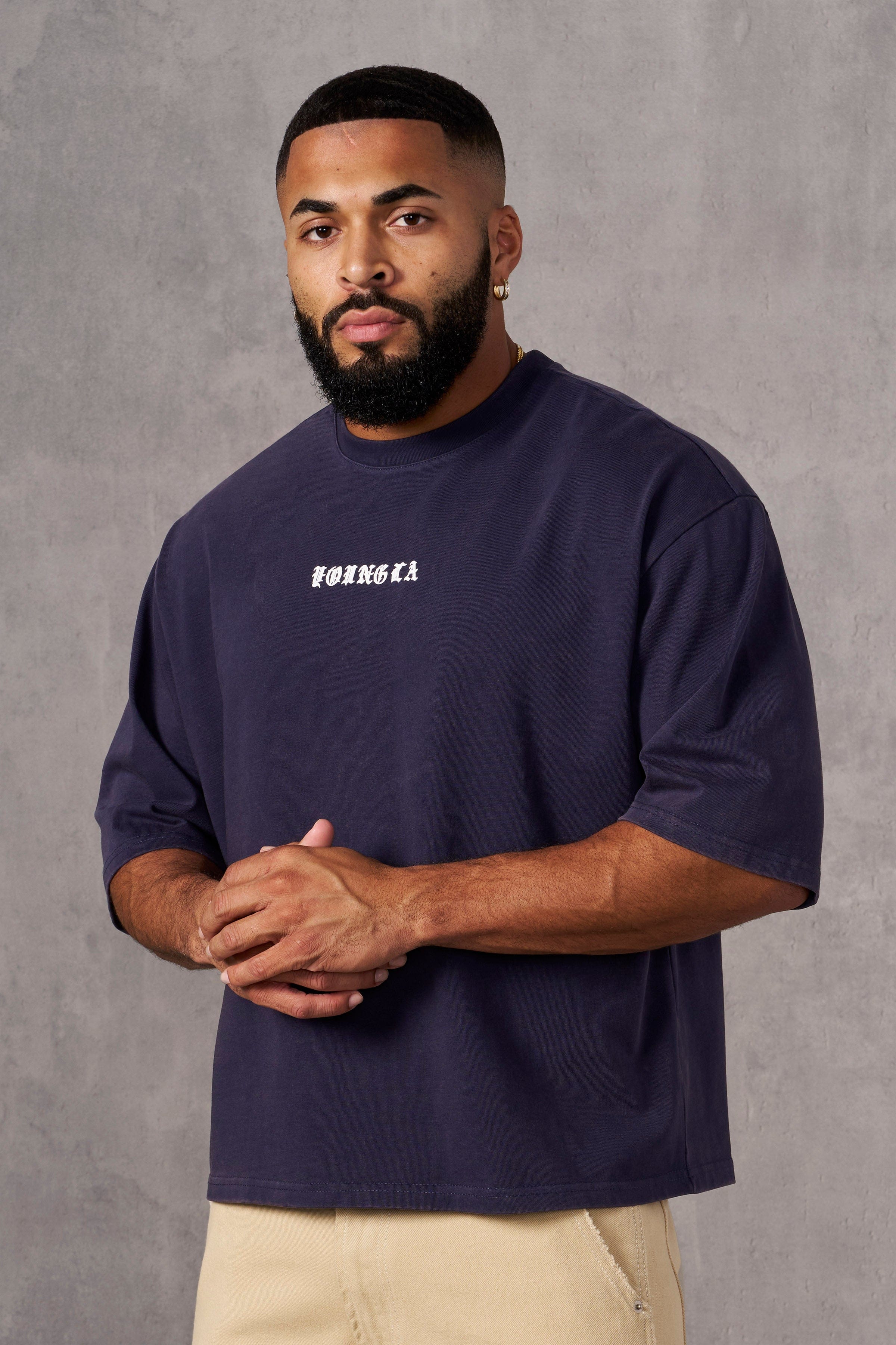 Close-up of heavy cotton t-shirt texture and chest logo detail