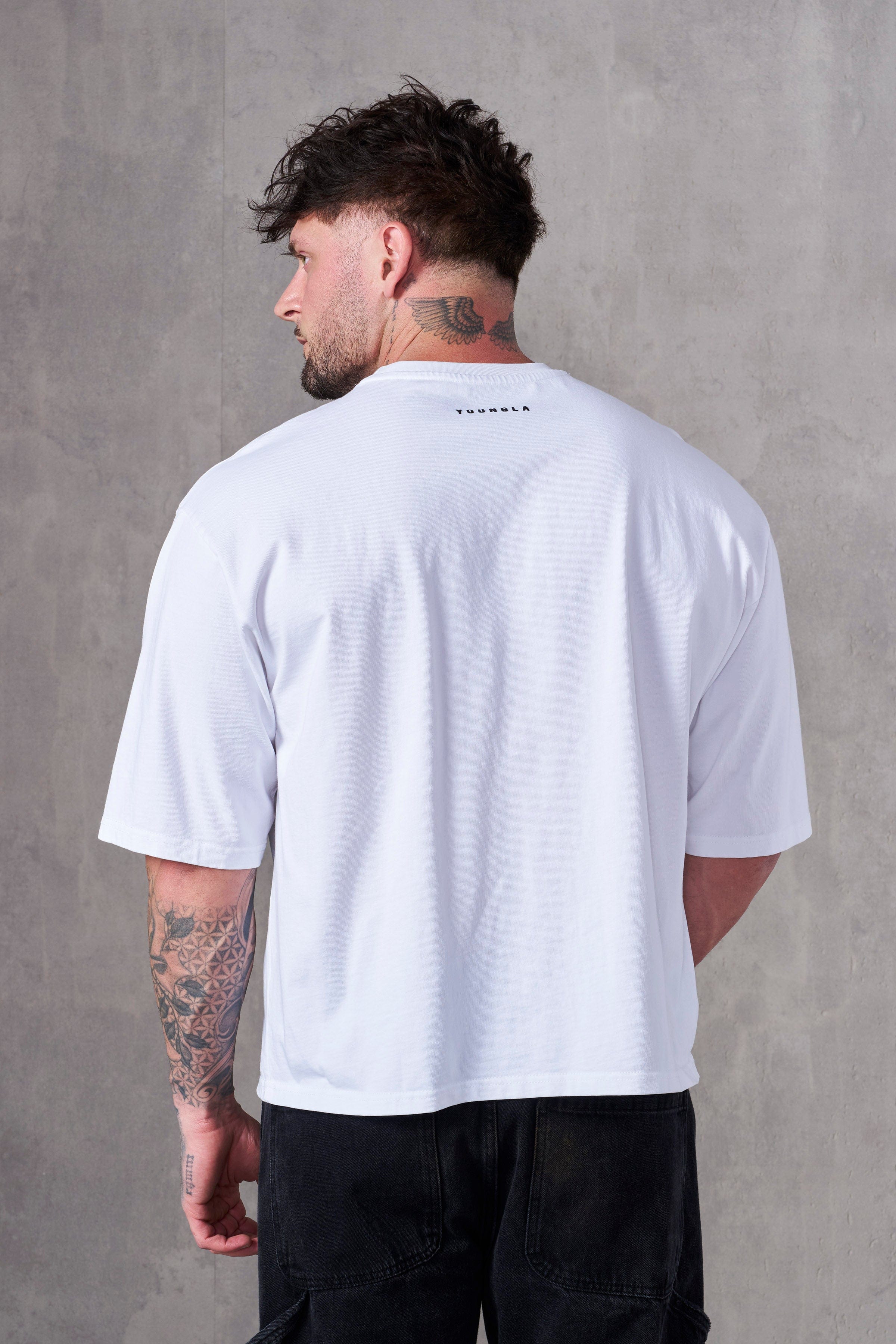 Close-up of heavy cotton t-shirt texture and chest logo detail