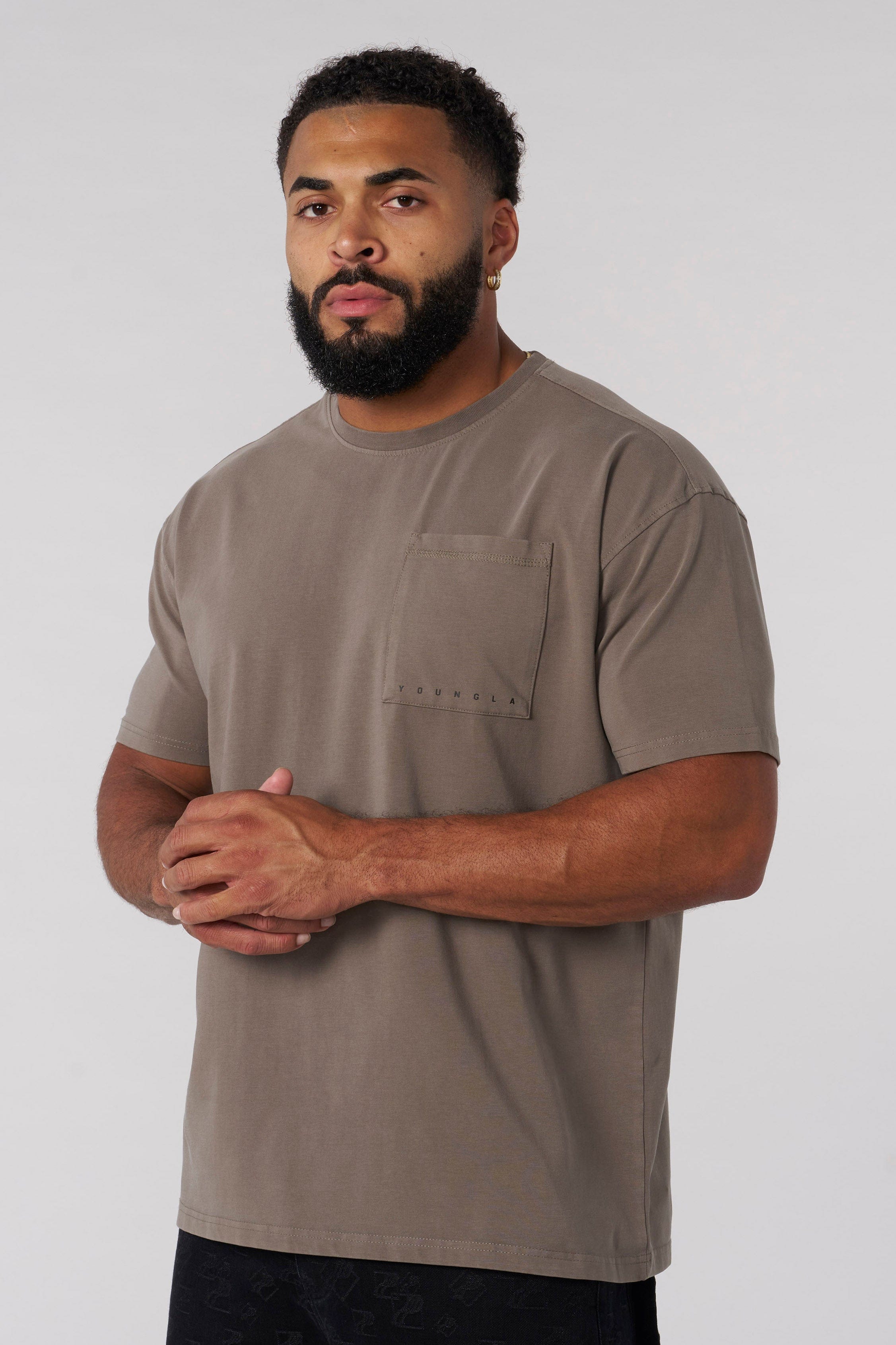 Front view of a fitted t-shirt with pocket, styled for city wear