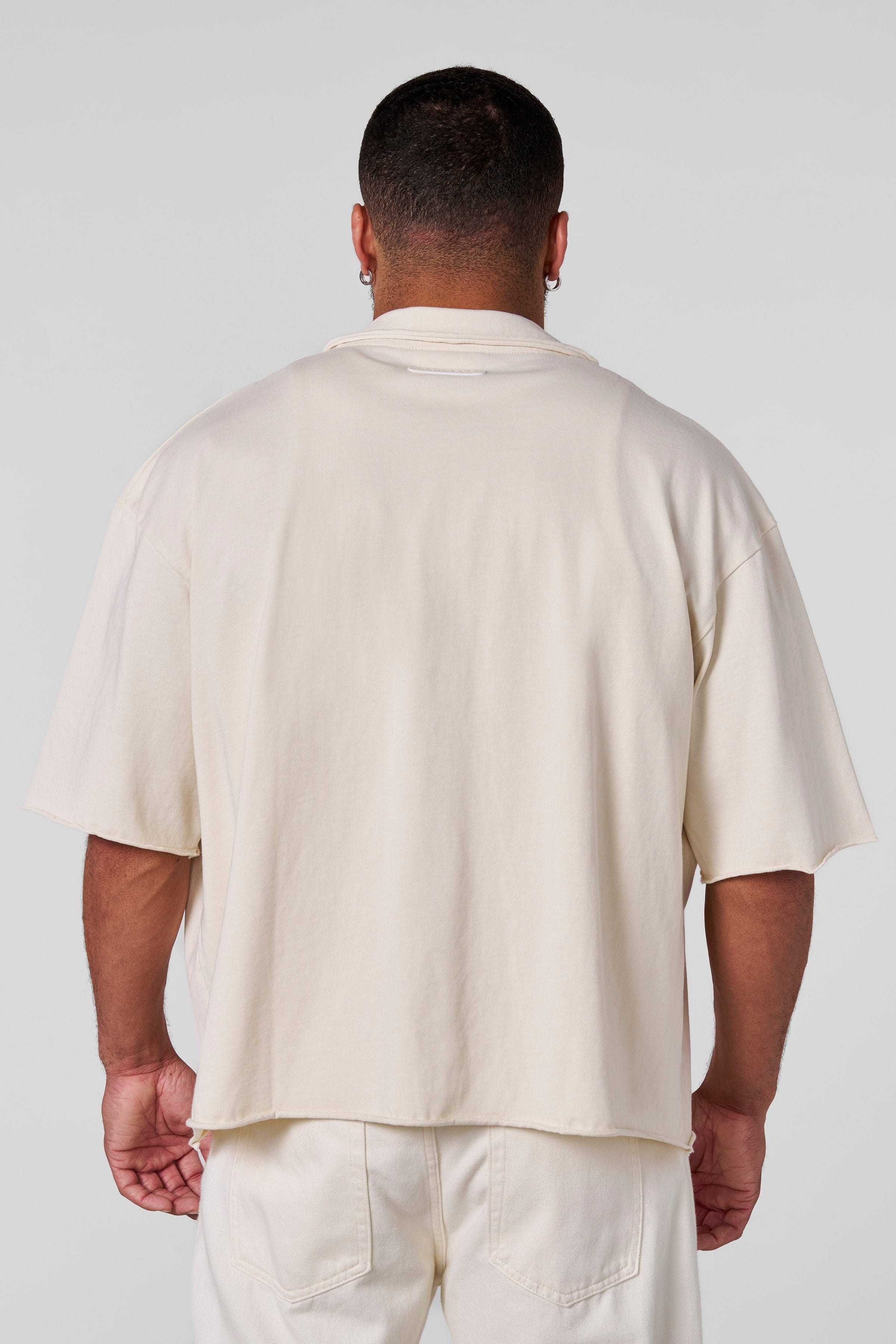 Front view of the Urban Edge oversized button up shirt on a model.