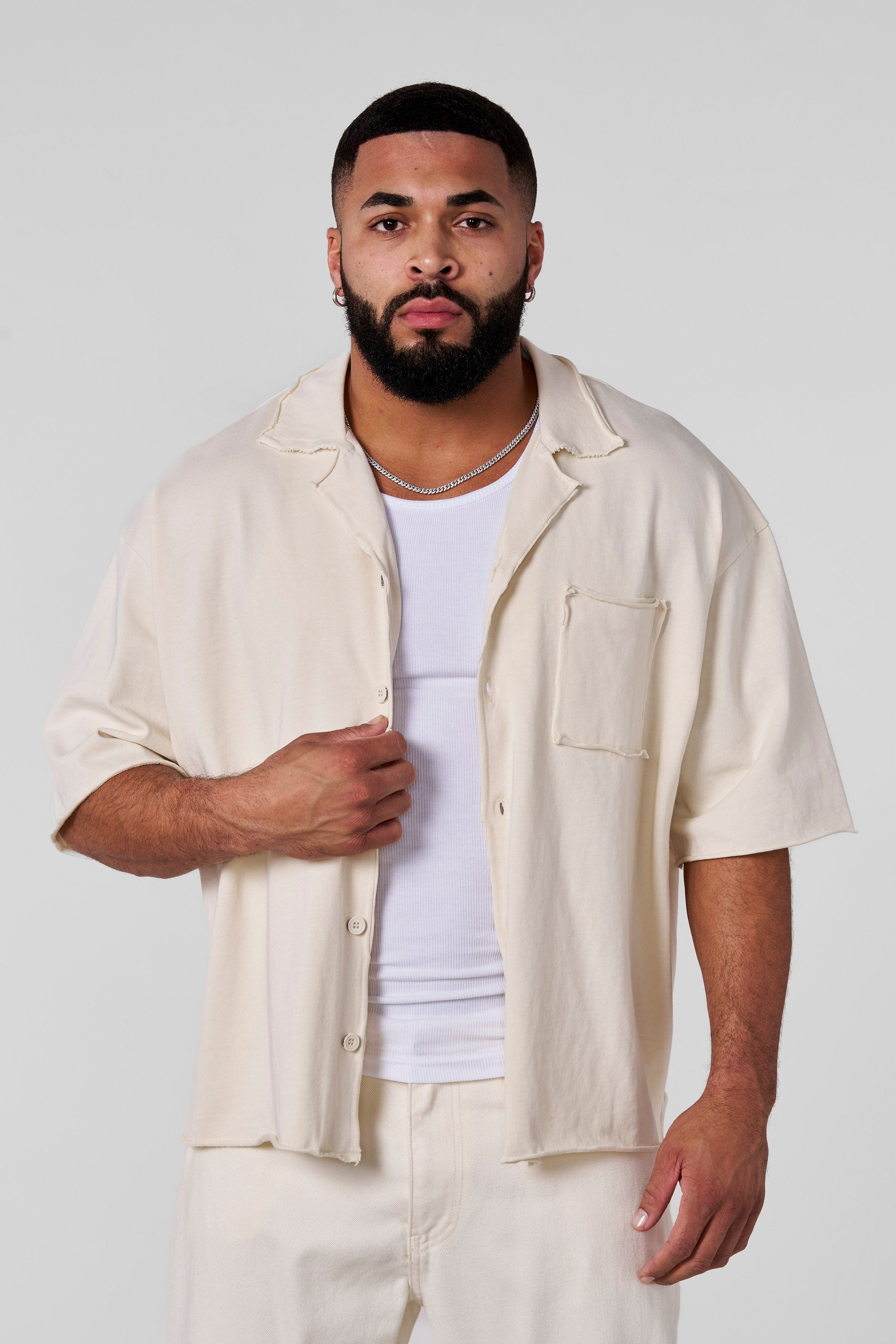 Front view of the Urban Edge oversized button up shirt on a model.