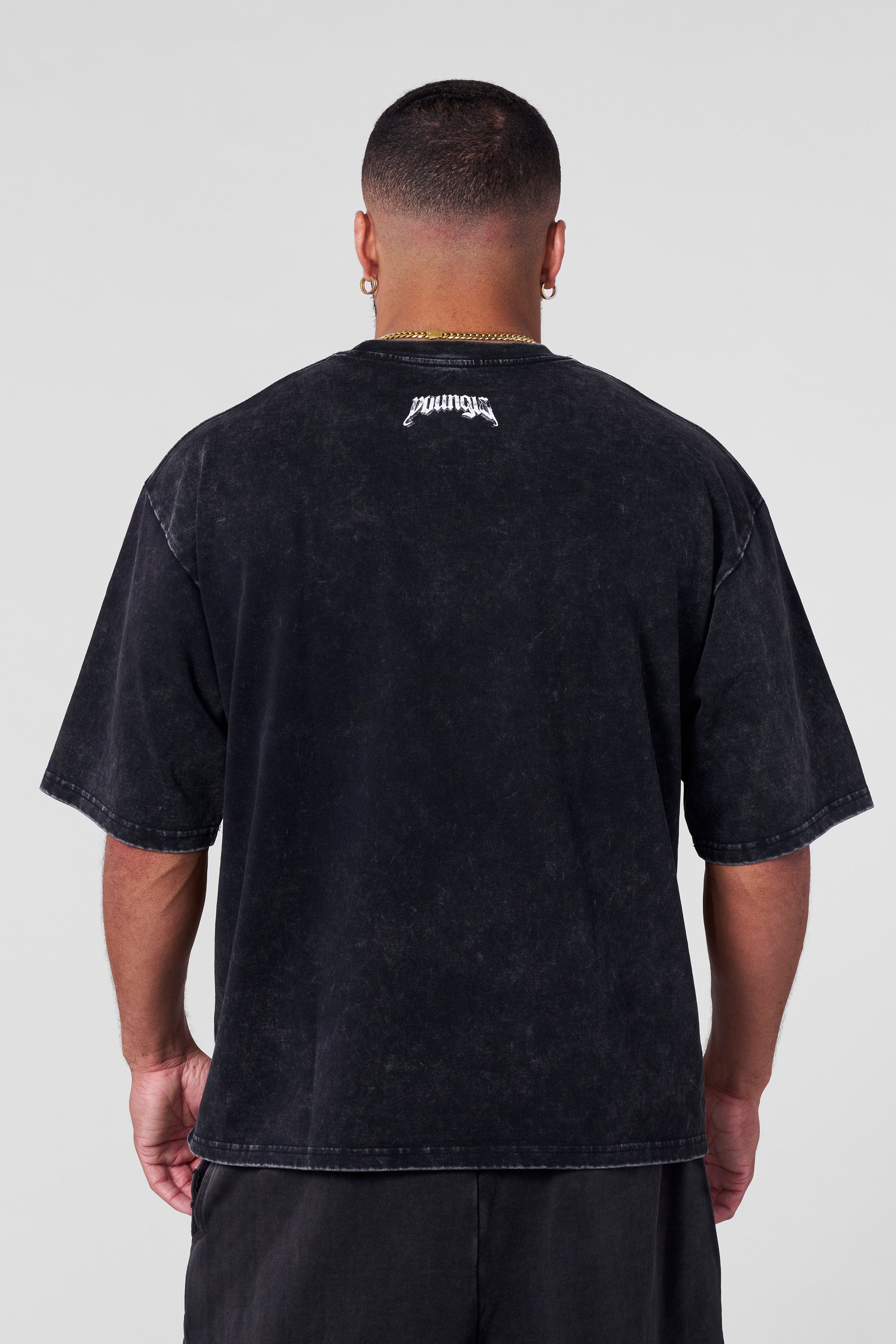 Streetwear model wearing oversized gods & heroes t-shirt