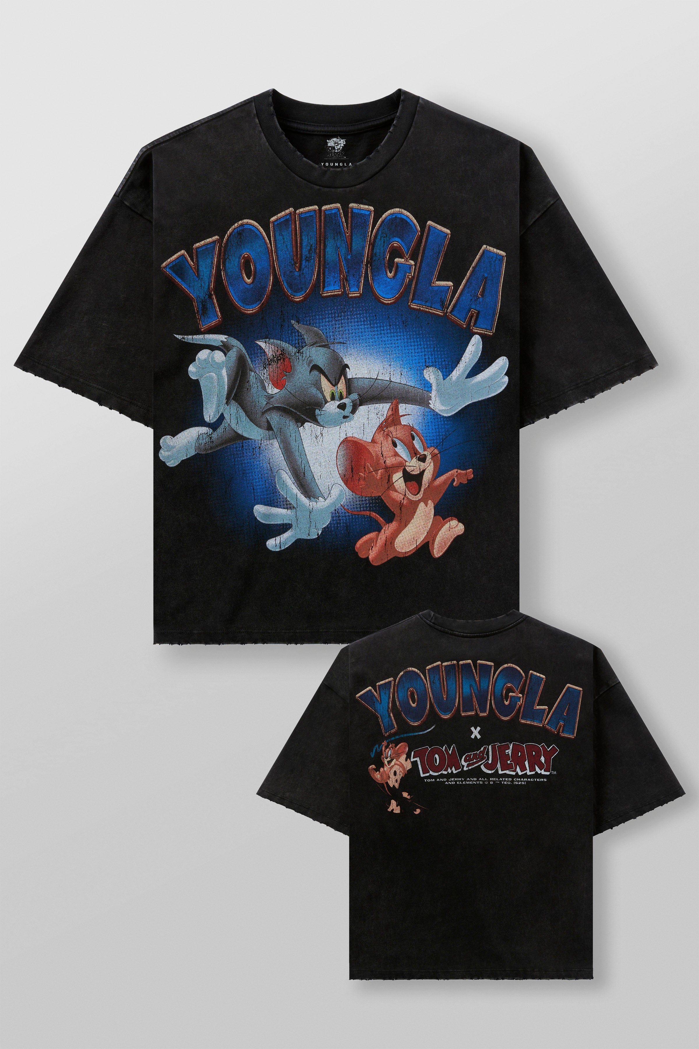 Model wearing oversized T shirt with nostalgic Tom & Jerry design in casual setting
