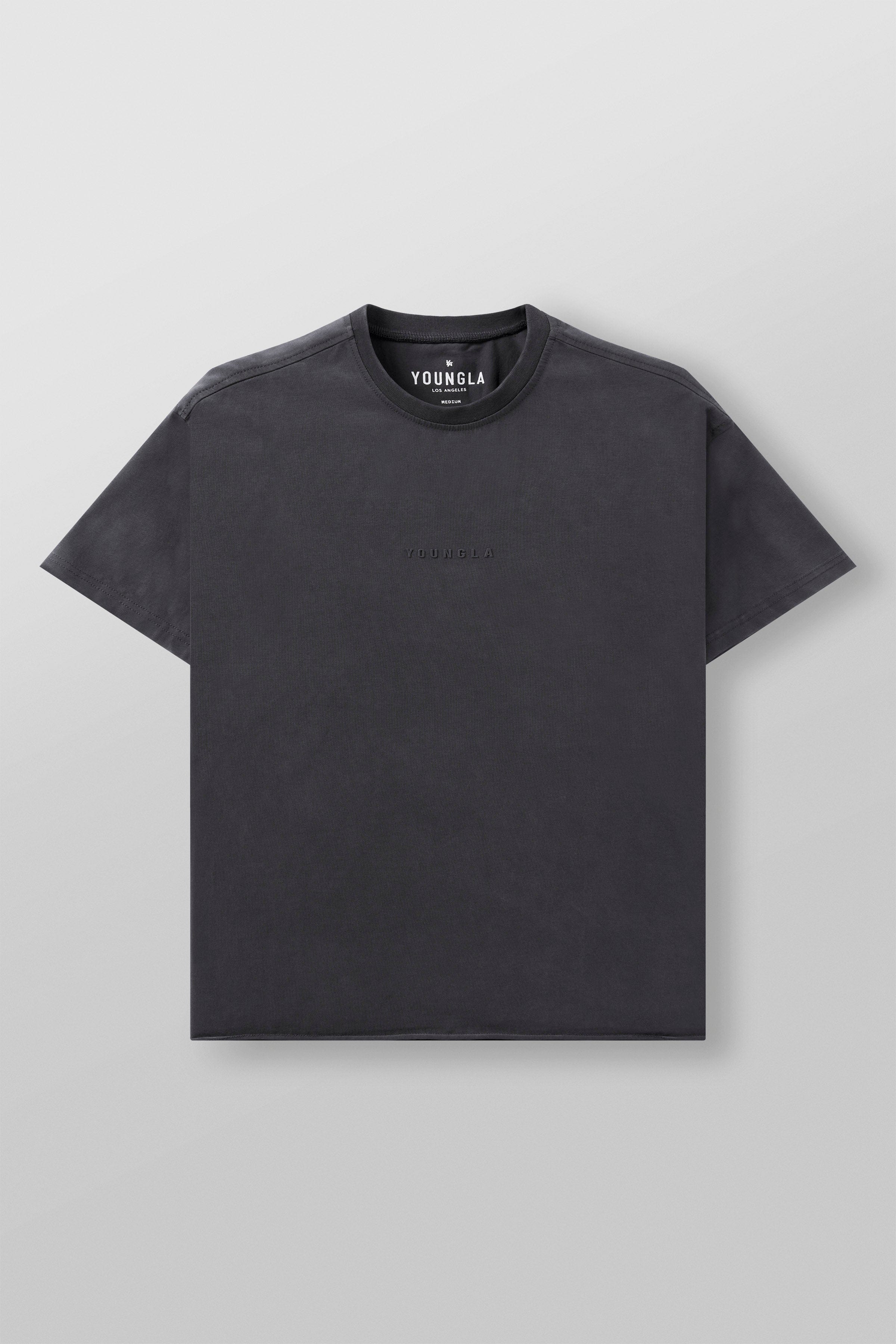 Close-up of the tailored details on the boxy crop tee, highlighting the fabric.