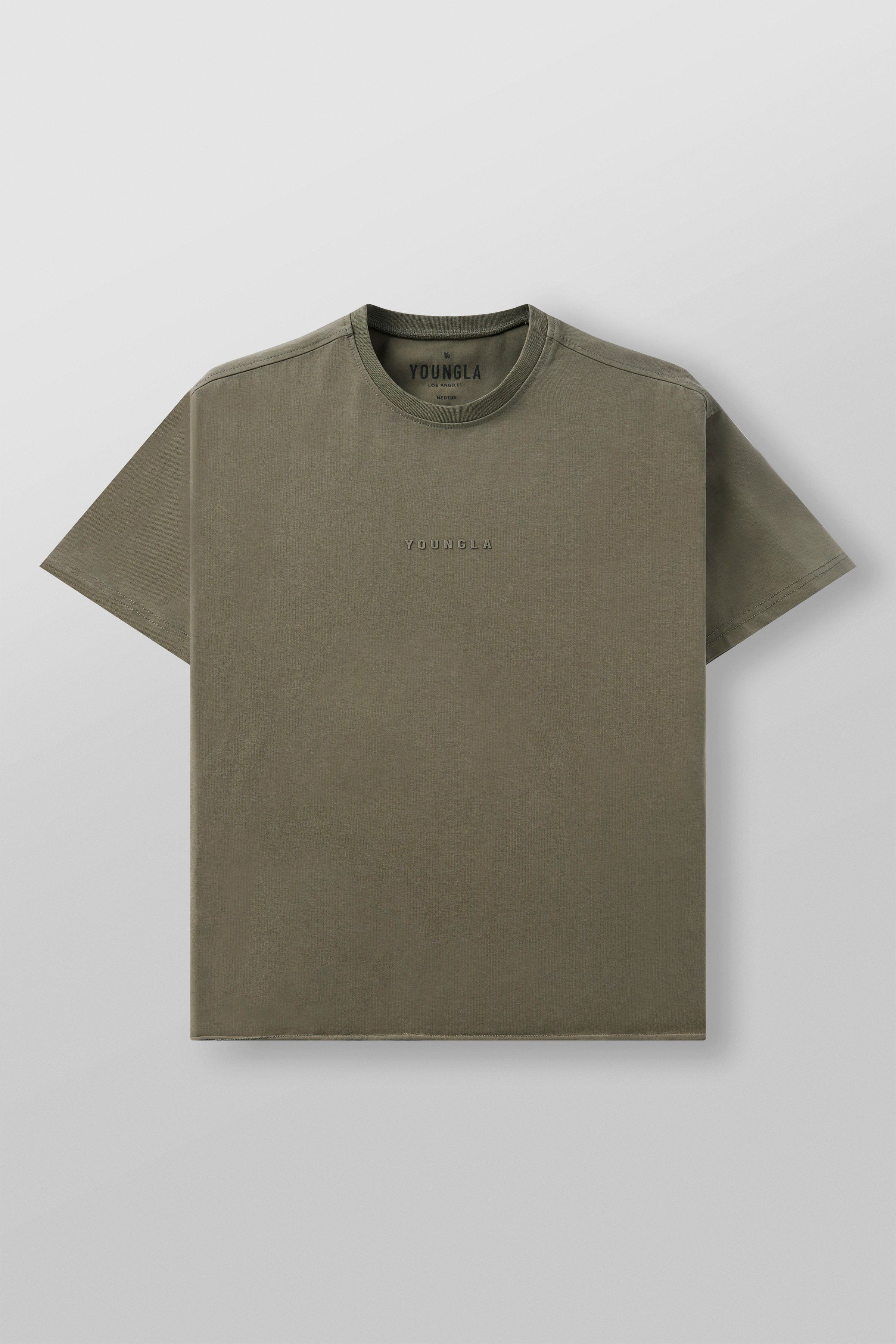 Front view of the oversized cropped tee on a model in a casual setting.