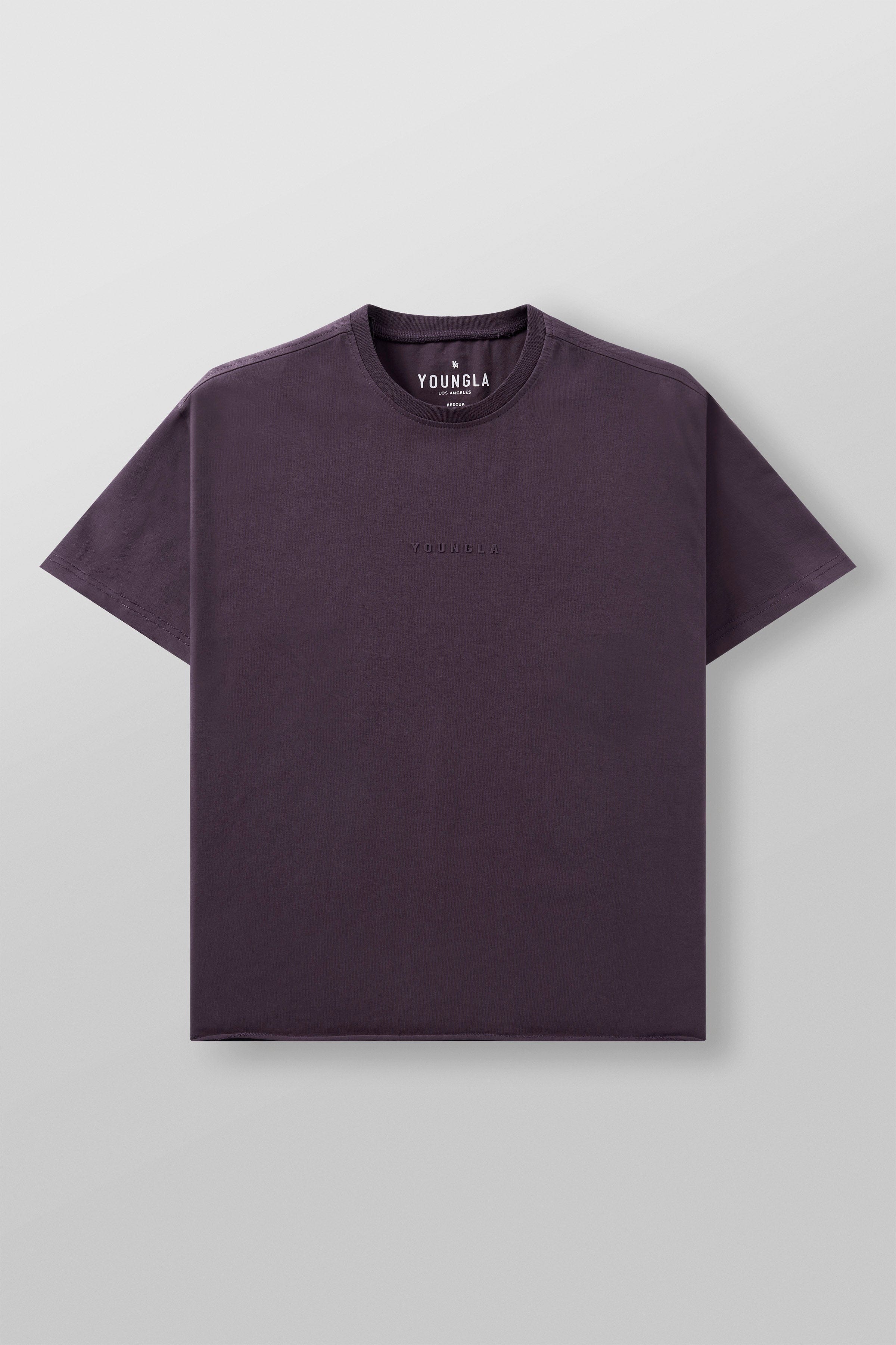 Close-up of the tailored details on the boxy crop tee, highlighting the fabric.