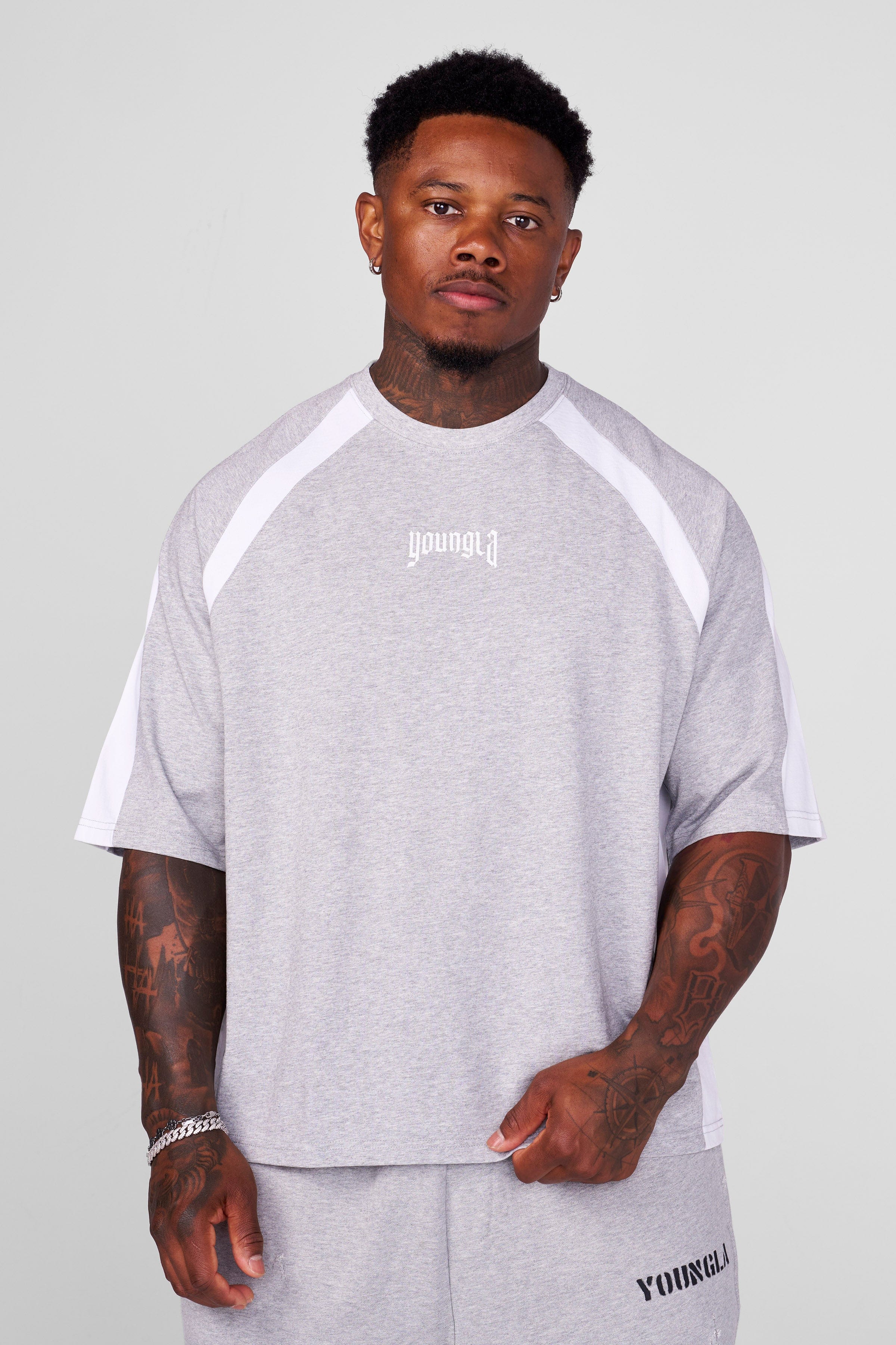 Close-up of the raglan paneling on the oversized t-shirt.