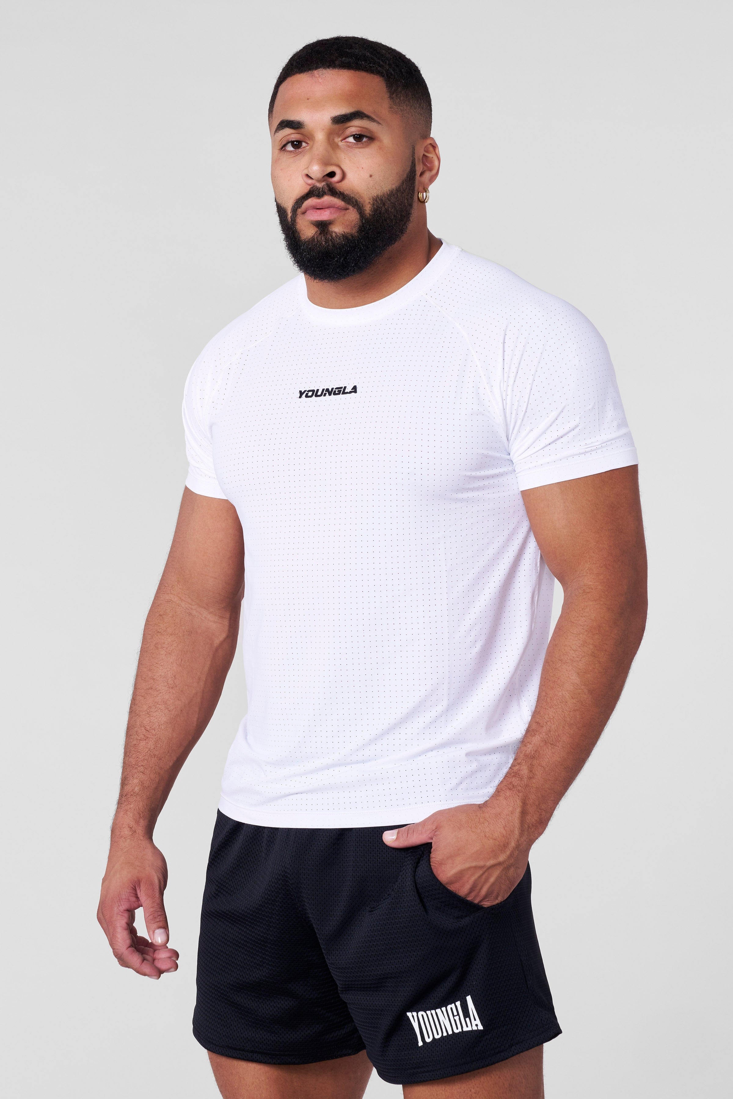 Model wearing fitness trainer t shirt outdoors on a sunny Los Angeles afternoon