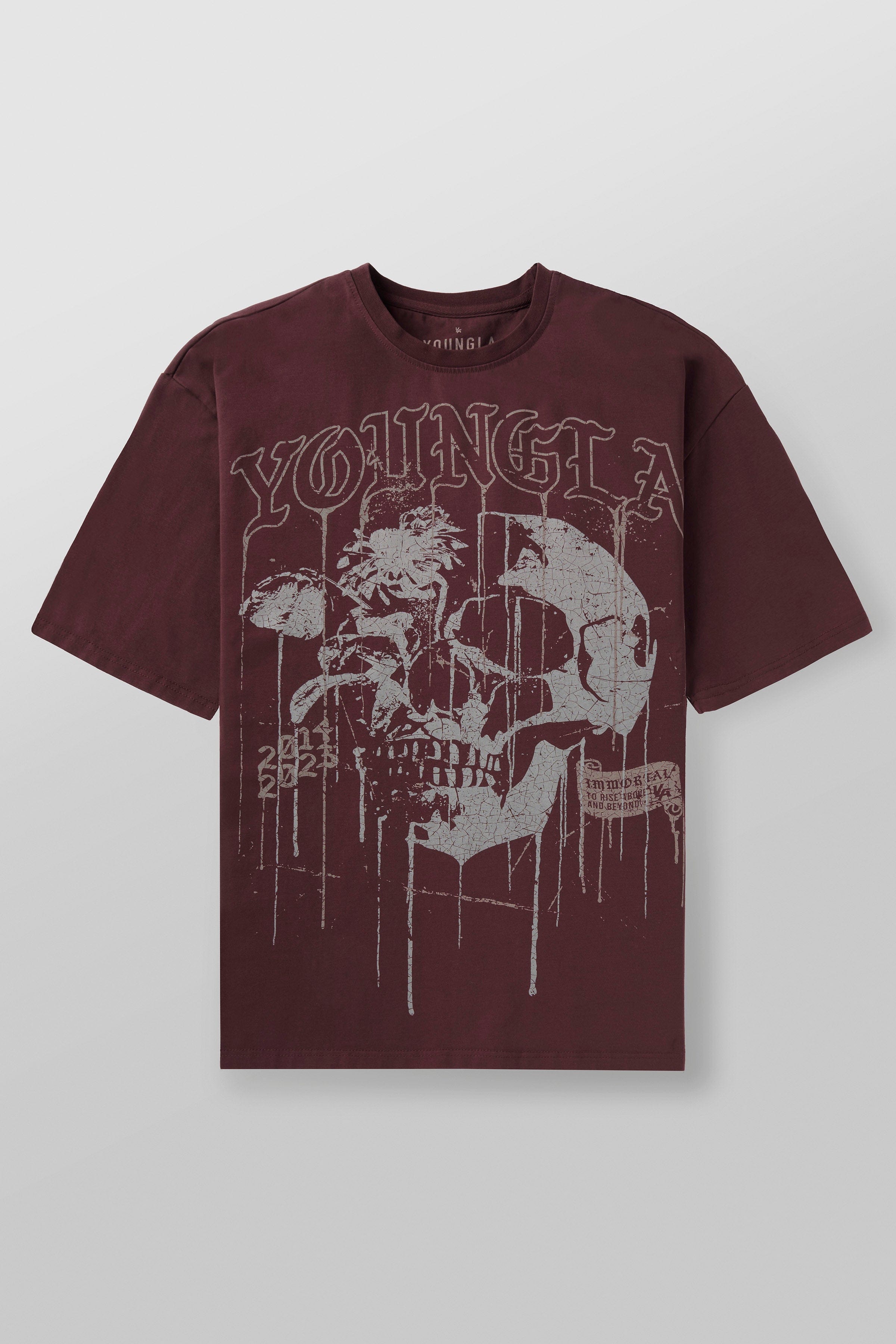 Front view of the floral skull graphic tee in casual setting.