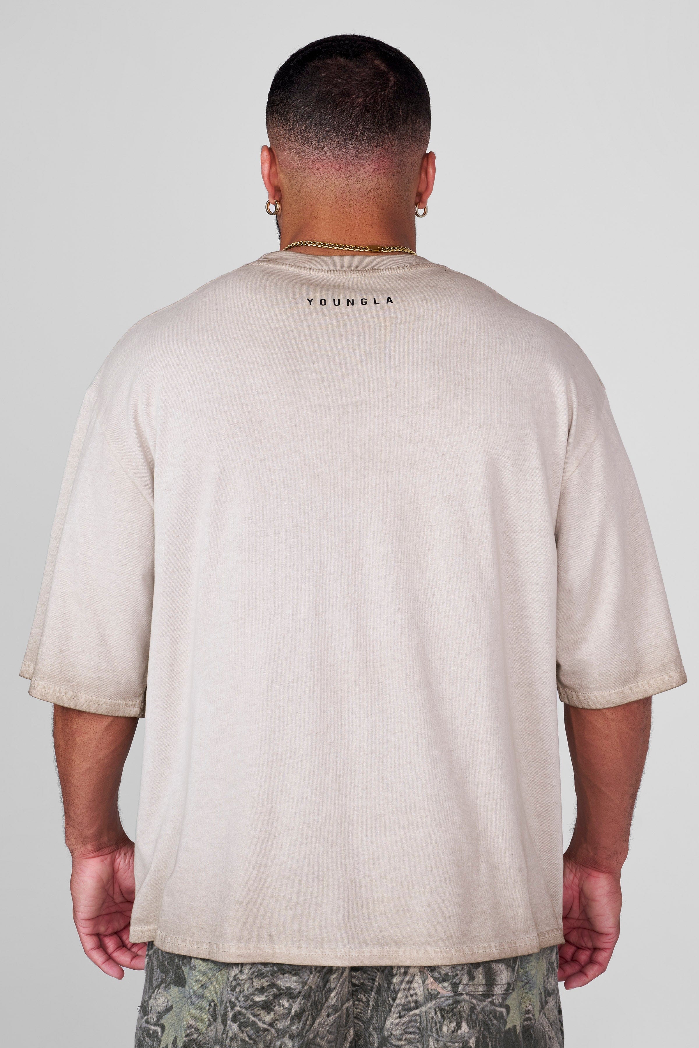 Front view of the Spartan Warrior Oversized Tee with helmet design.