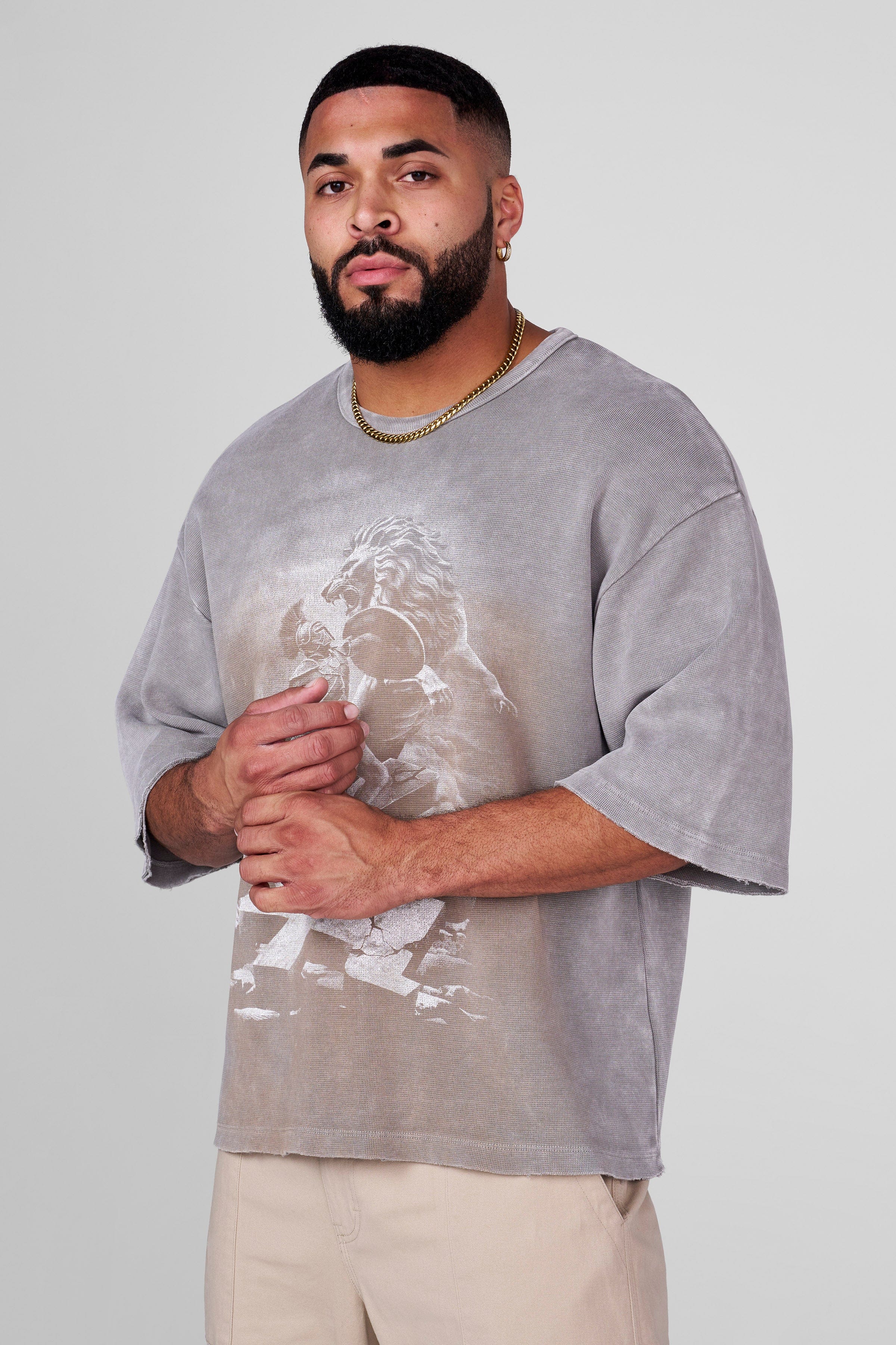 Front view of oversized tee showing gladiator-lion graphic