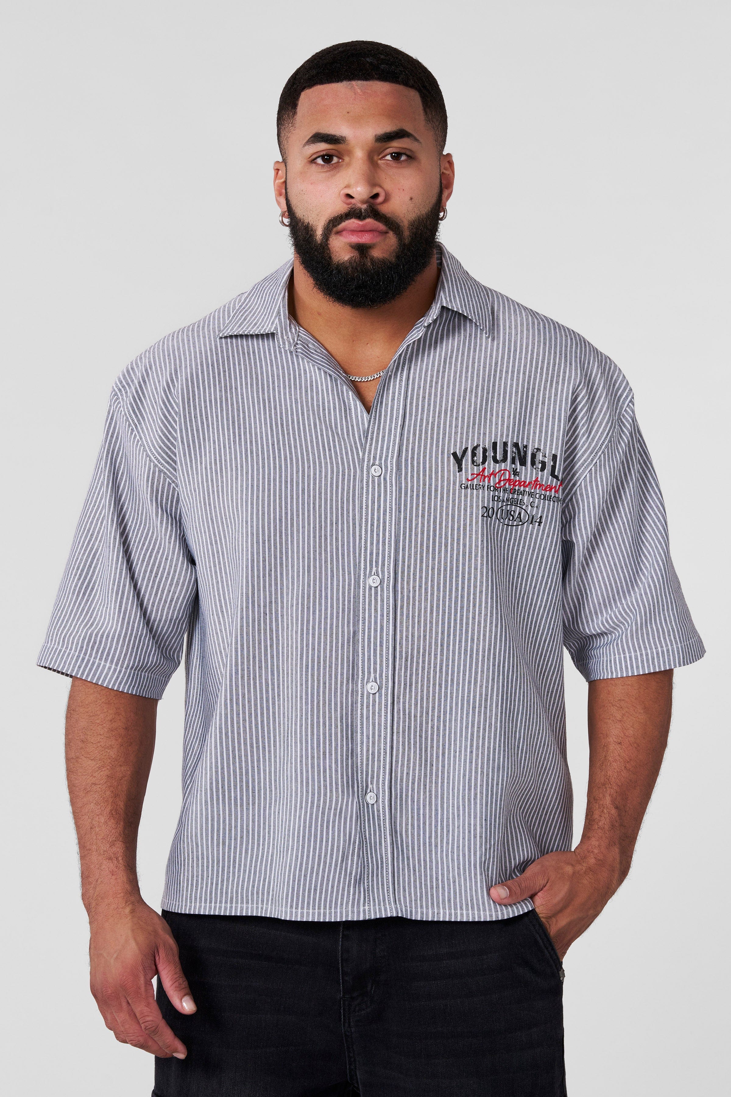 Front view of a classic workwear shirt in black, ideal for casual and professional settings.