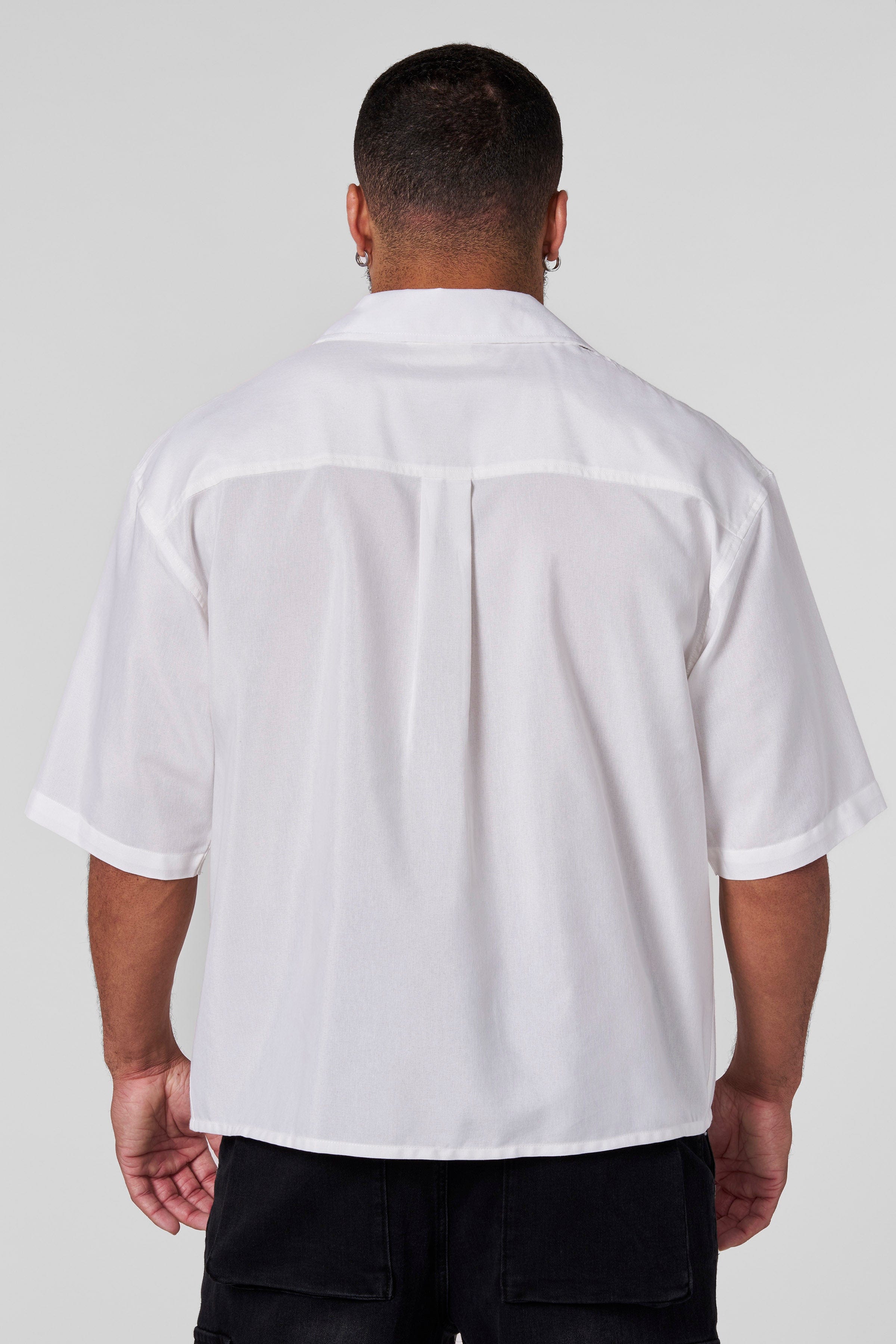 Detail shot of the shirts subtle graphic, highlighting its vintage mechanic tee inspiration.