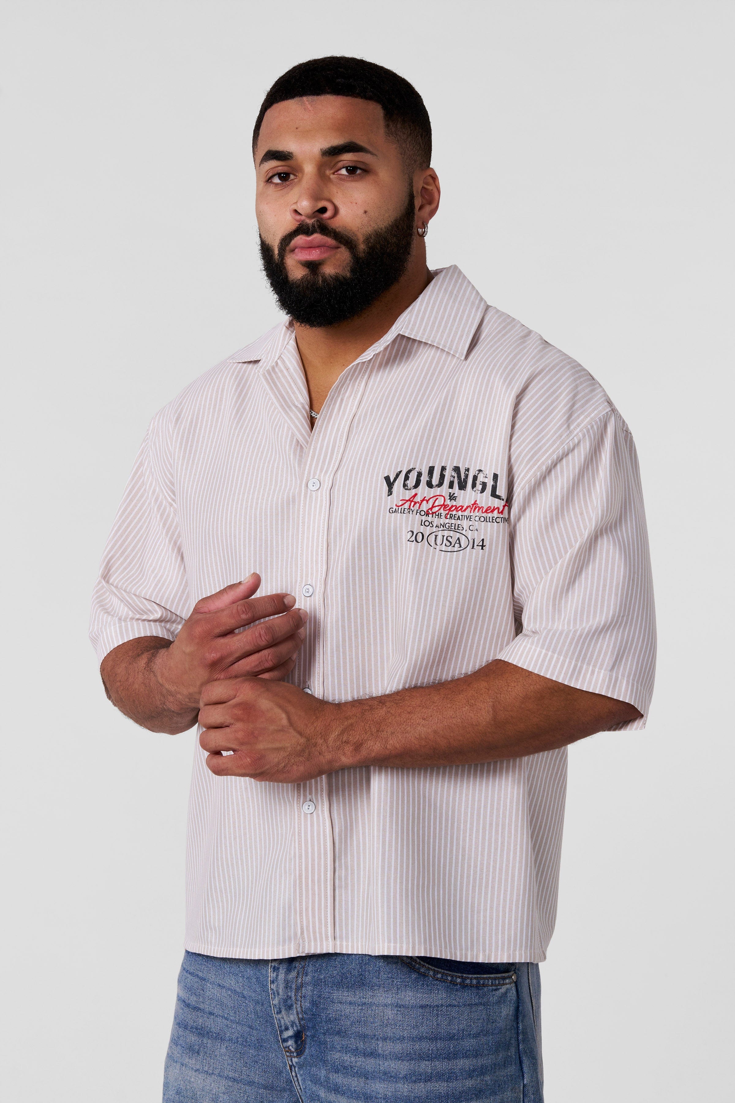 Detail shot of the shirts subtle graphic, highlighting its vintage mechanic tee inspiration.