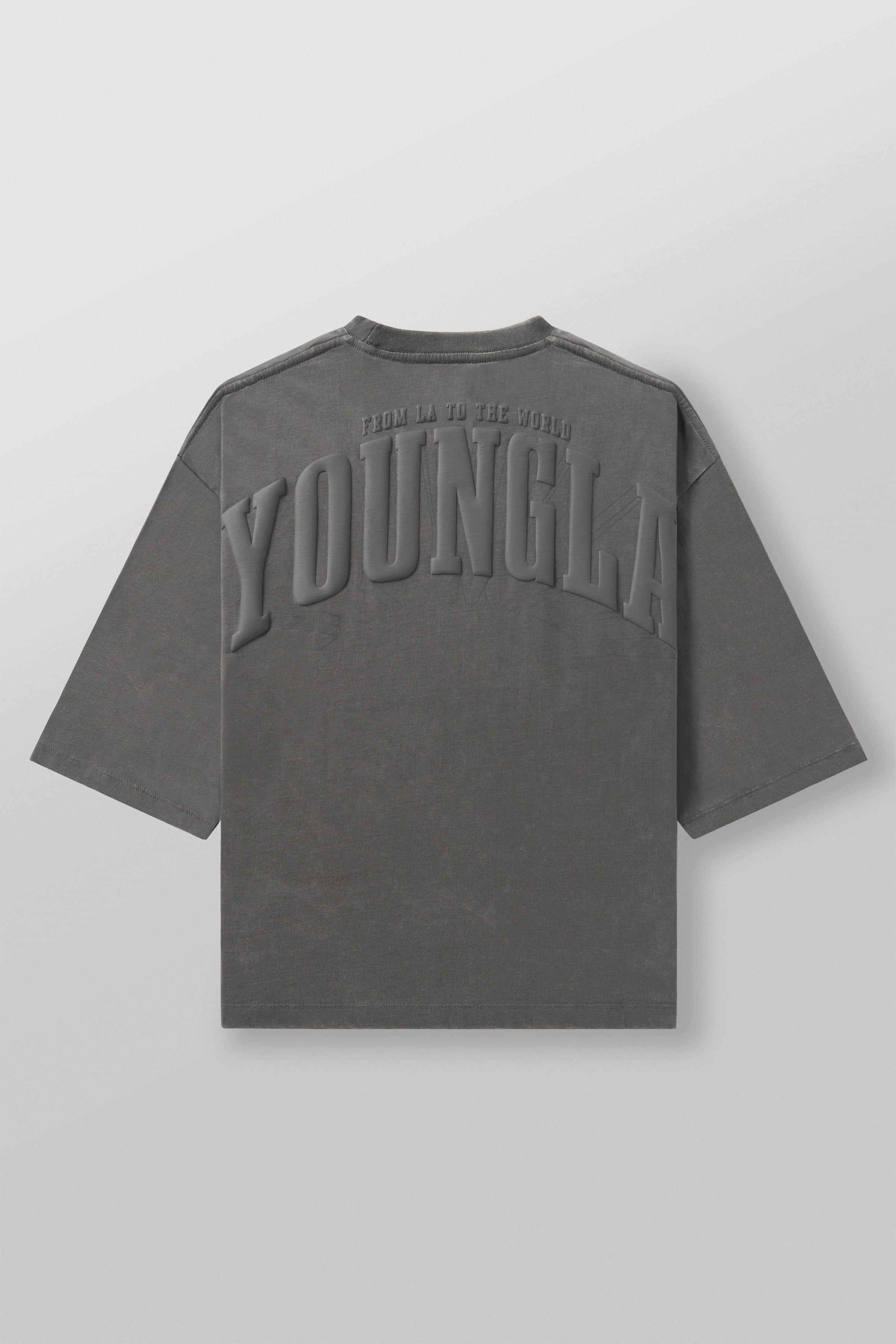 Close-up of the boxy cropped tee’s puff print logo on black fabric