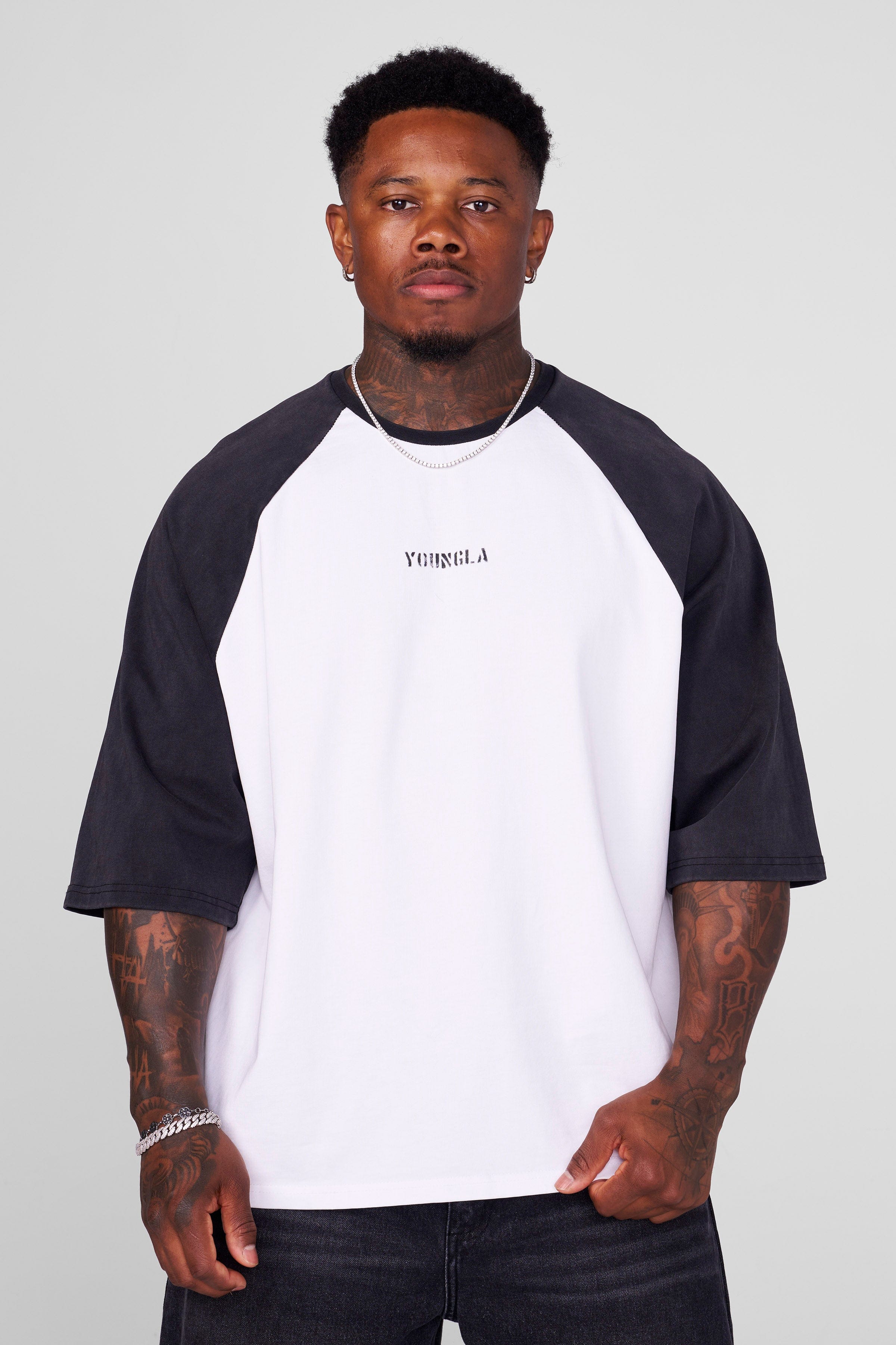 Front view of mens oversized baseball tee in black with vintage design.