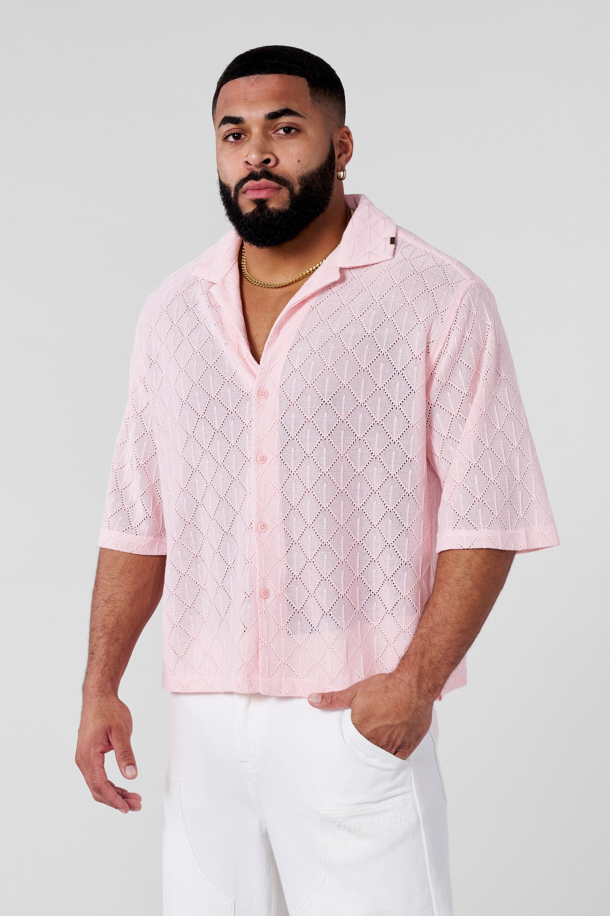 Model wearing the crochet button-up at a casual outdoor event.