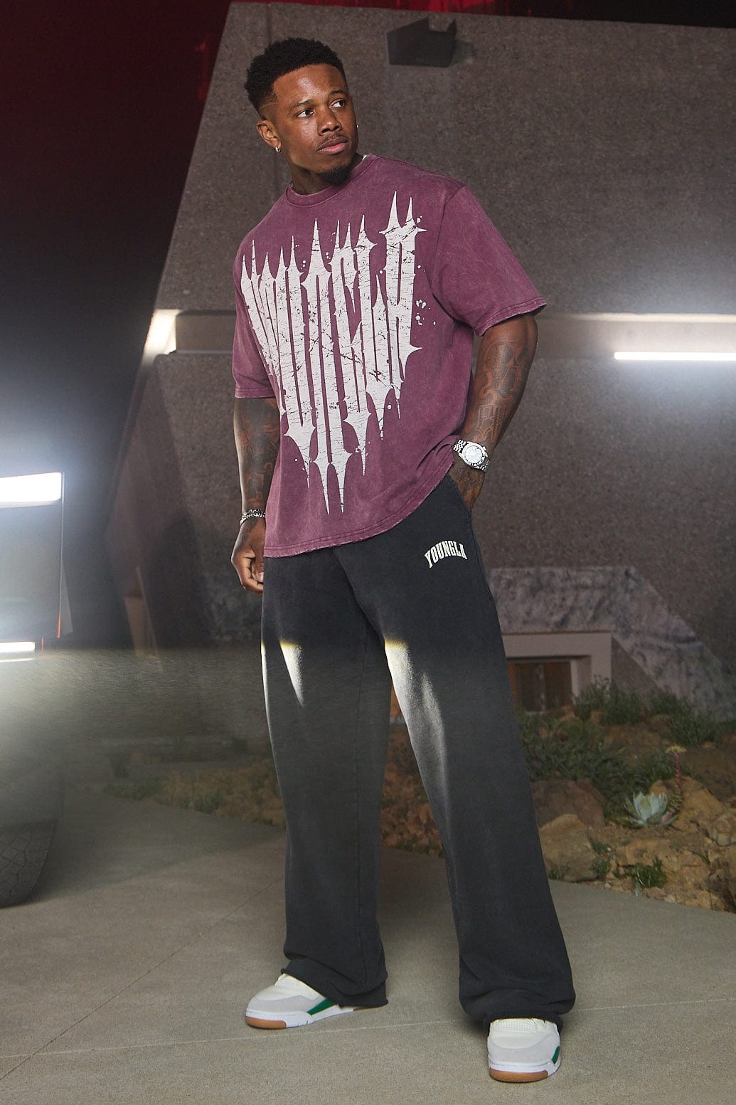 Side view of baggy sweat pants, highlighting the unique pigment-washed fabric.
