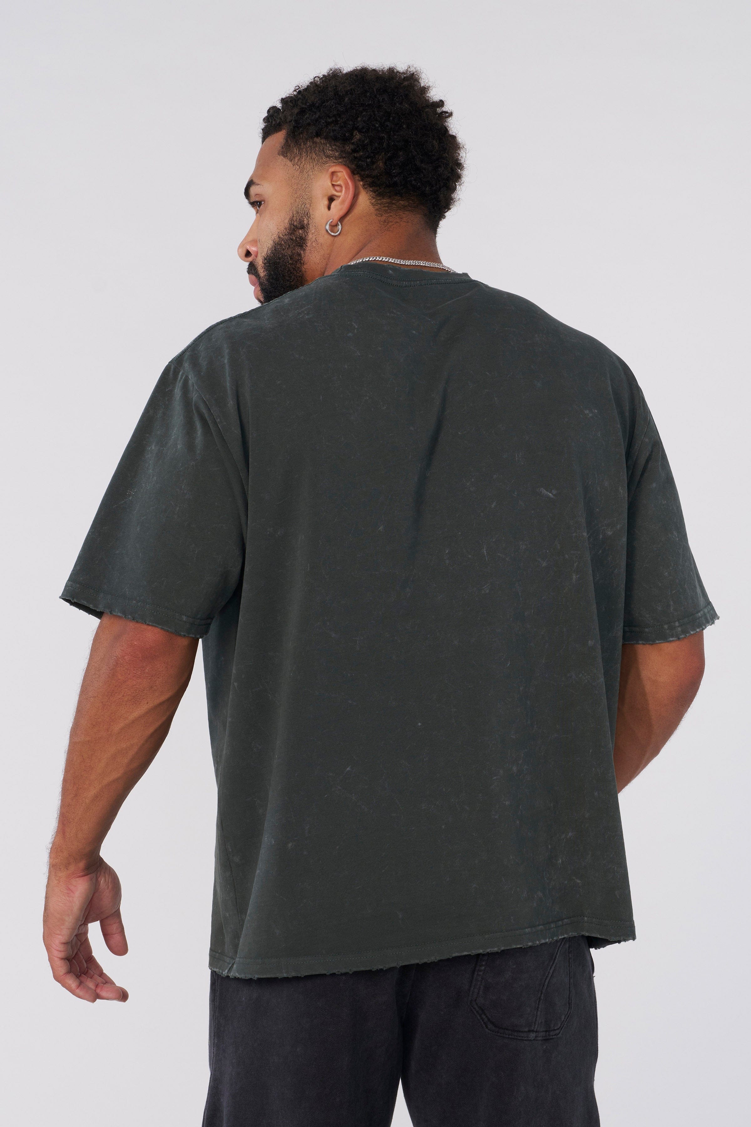 Model wearing an oversized T shirt with vintage graphic design for casual style