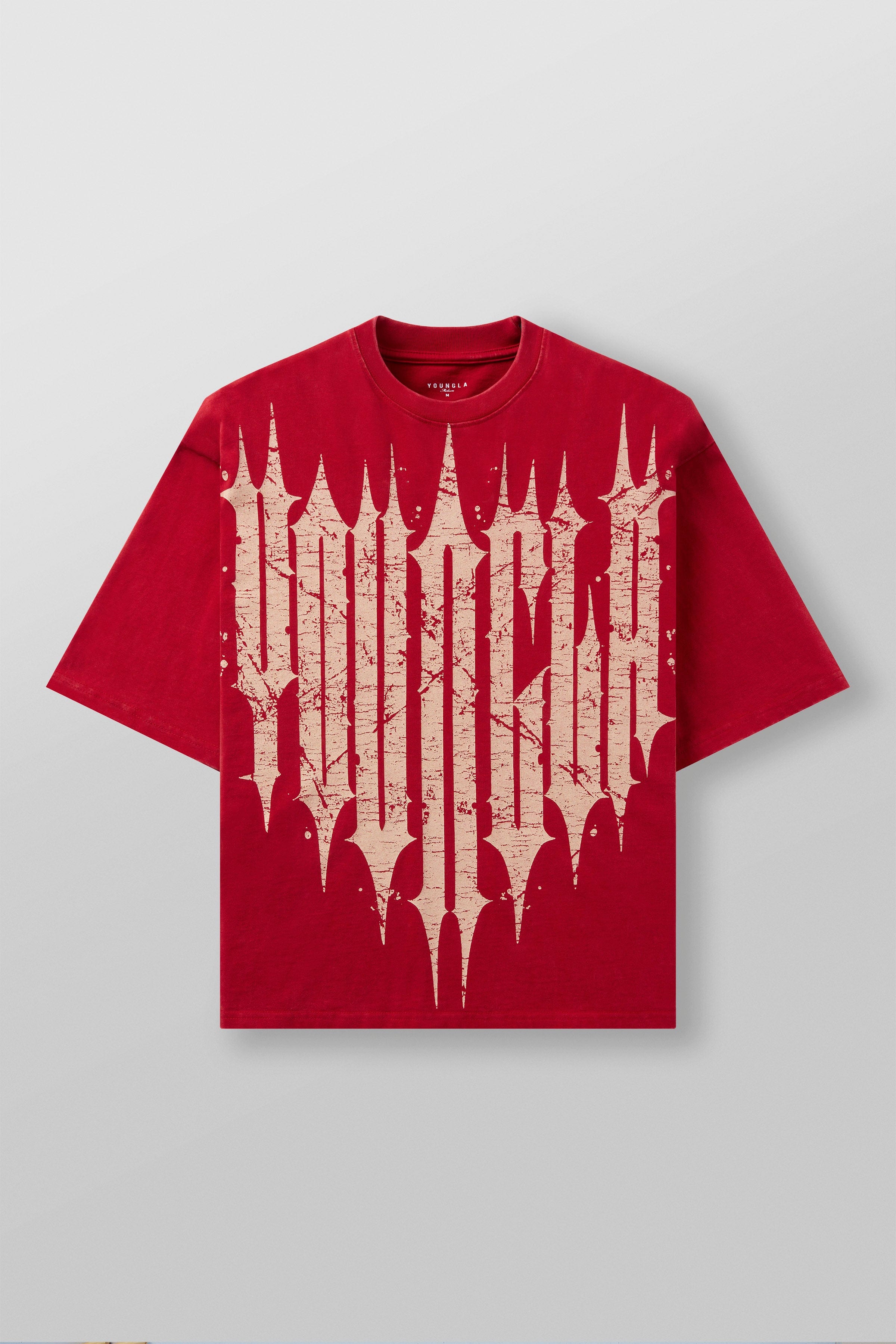 Close-up of distressed gothic graphic on oversized cotton shirt