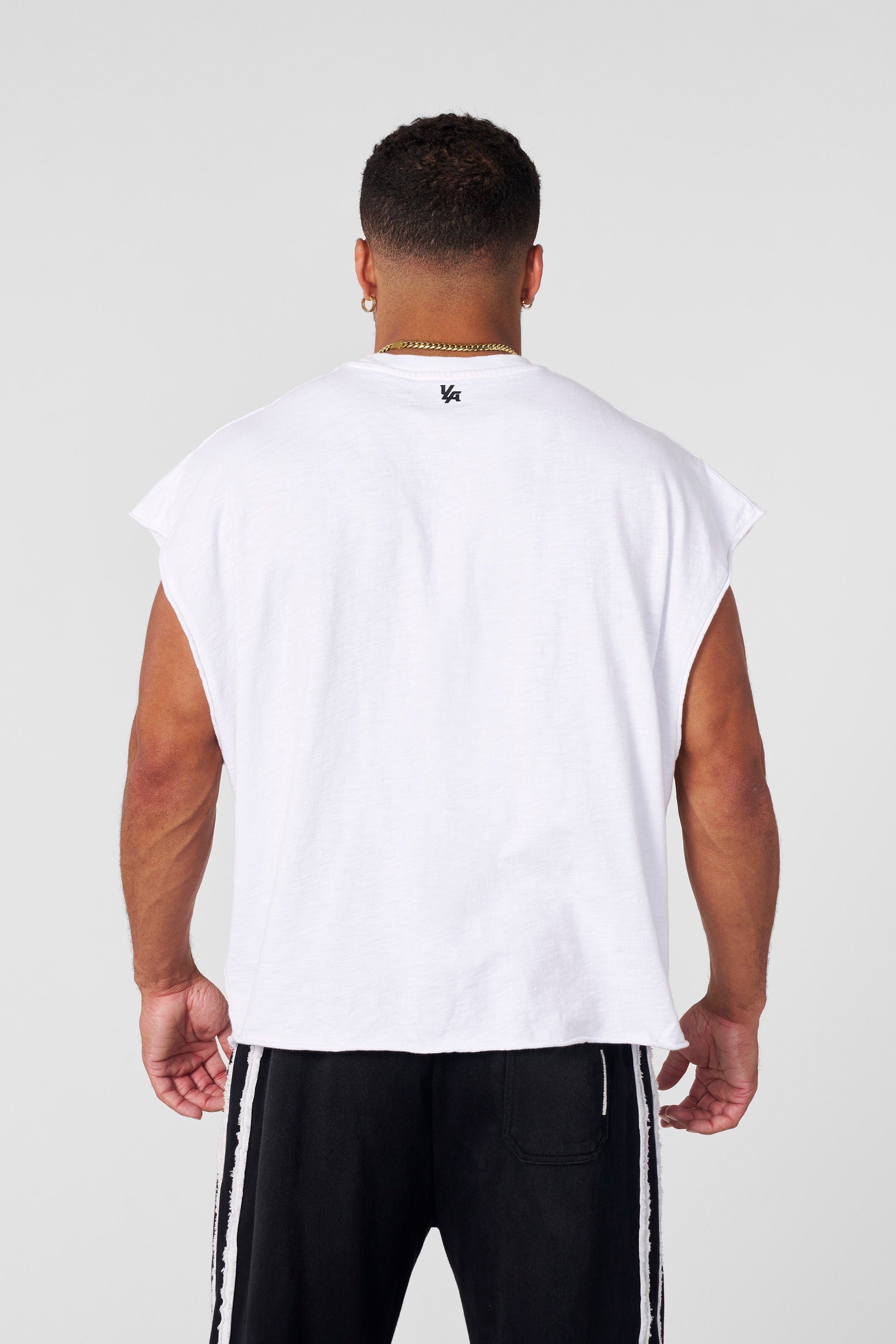 Side profile of sleeveless fitness apparel during workout session