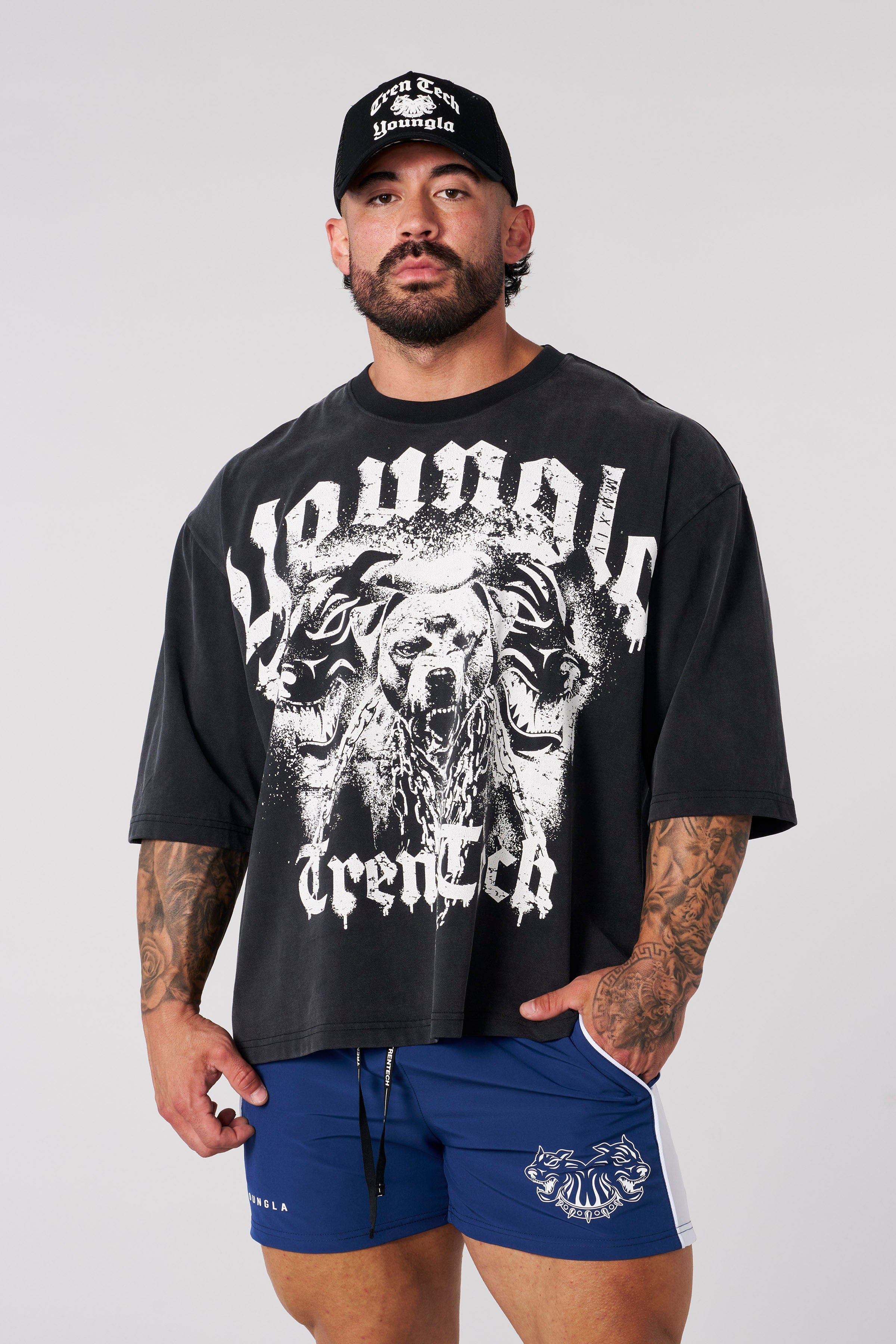 Styled urban look with model wearing puppy dog shirt paired with denim and sneakers