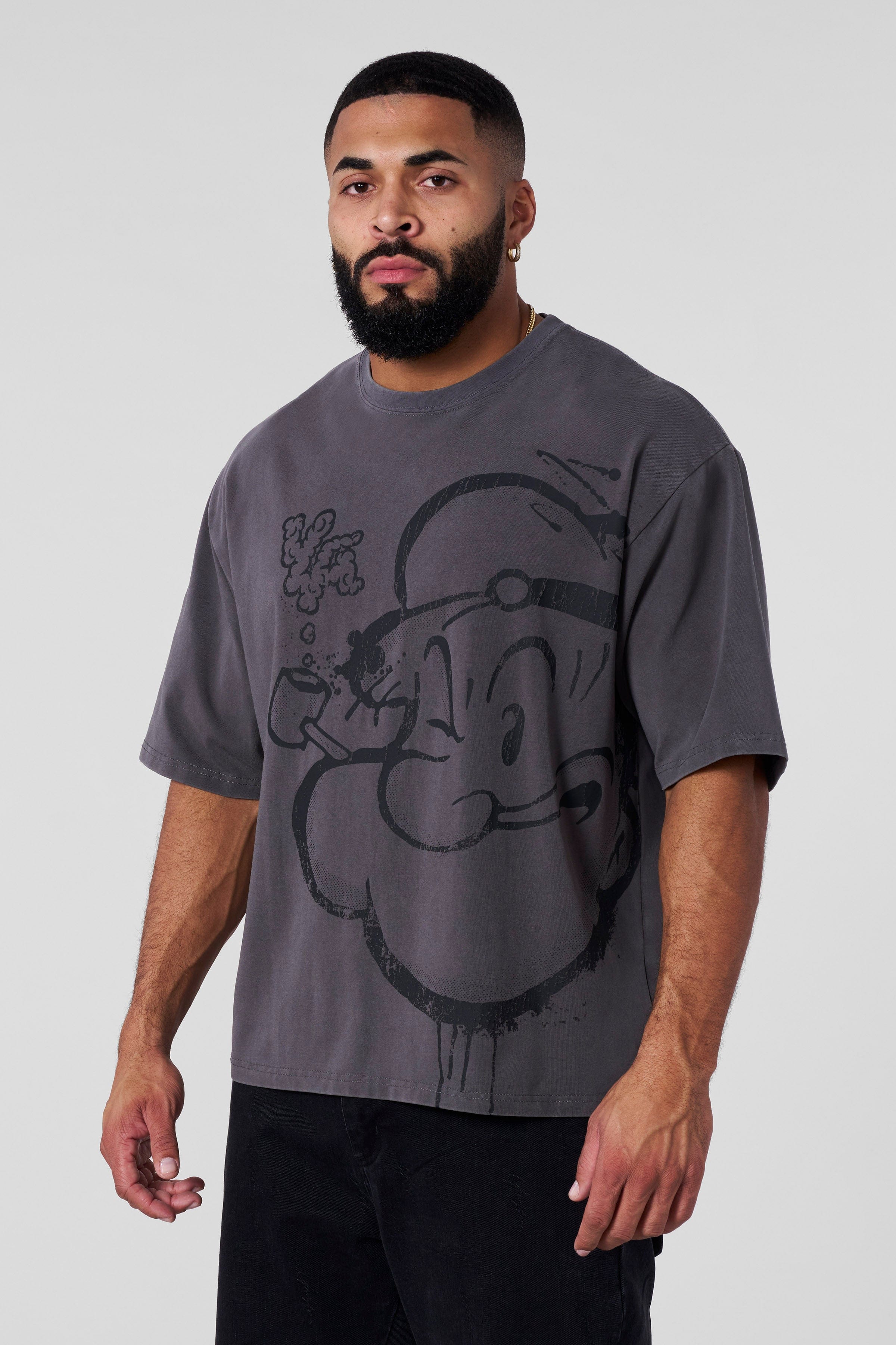 Close-up of the bold Popeye and YoungLA graphics on the casual T-shirt