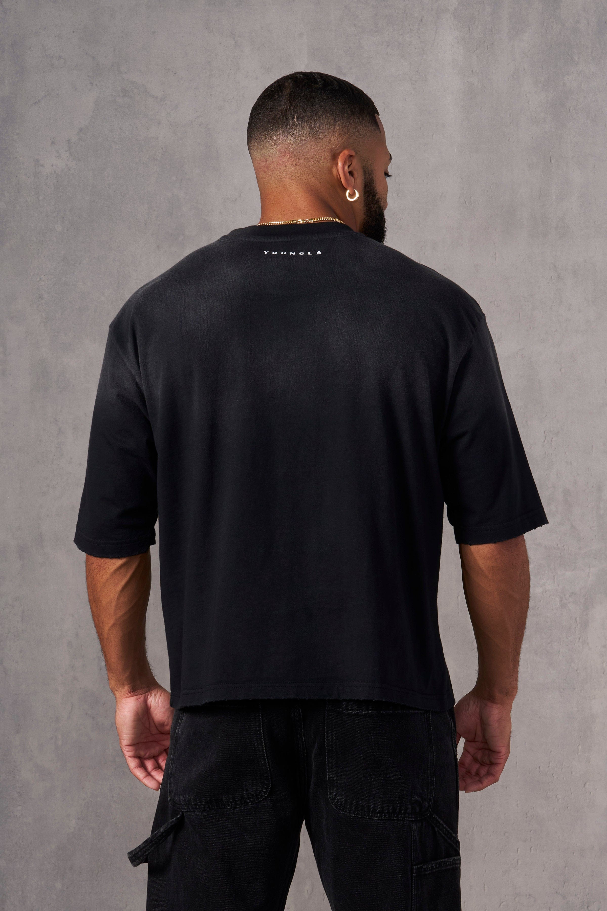 Front view of an art-inspired graphic tee in a boxy fit.