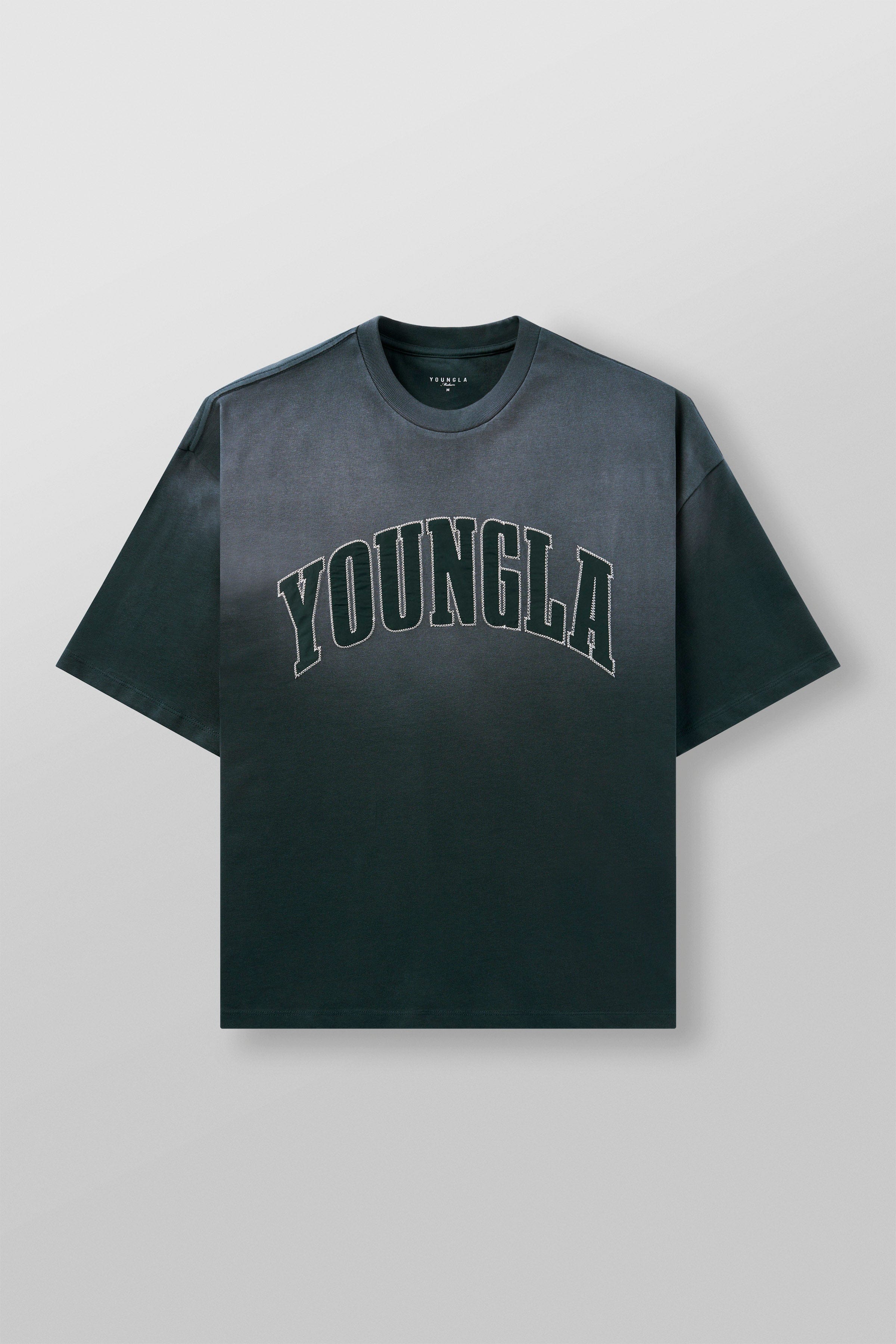 Back detail of oversized t-shirts showing relaxed drop shoulder fit and washed texture