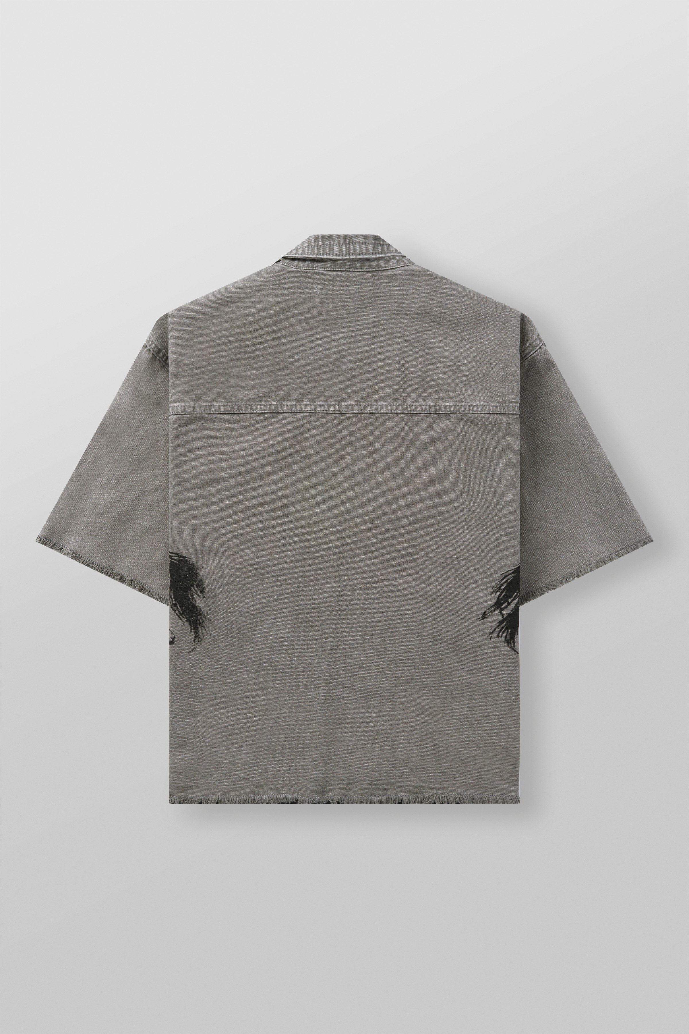 Close-up of distressed sleeve detailing on mens short sleeve button up