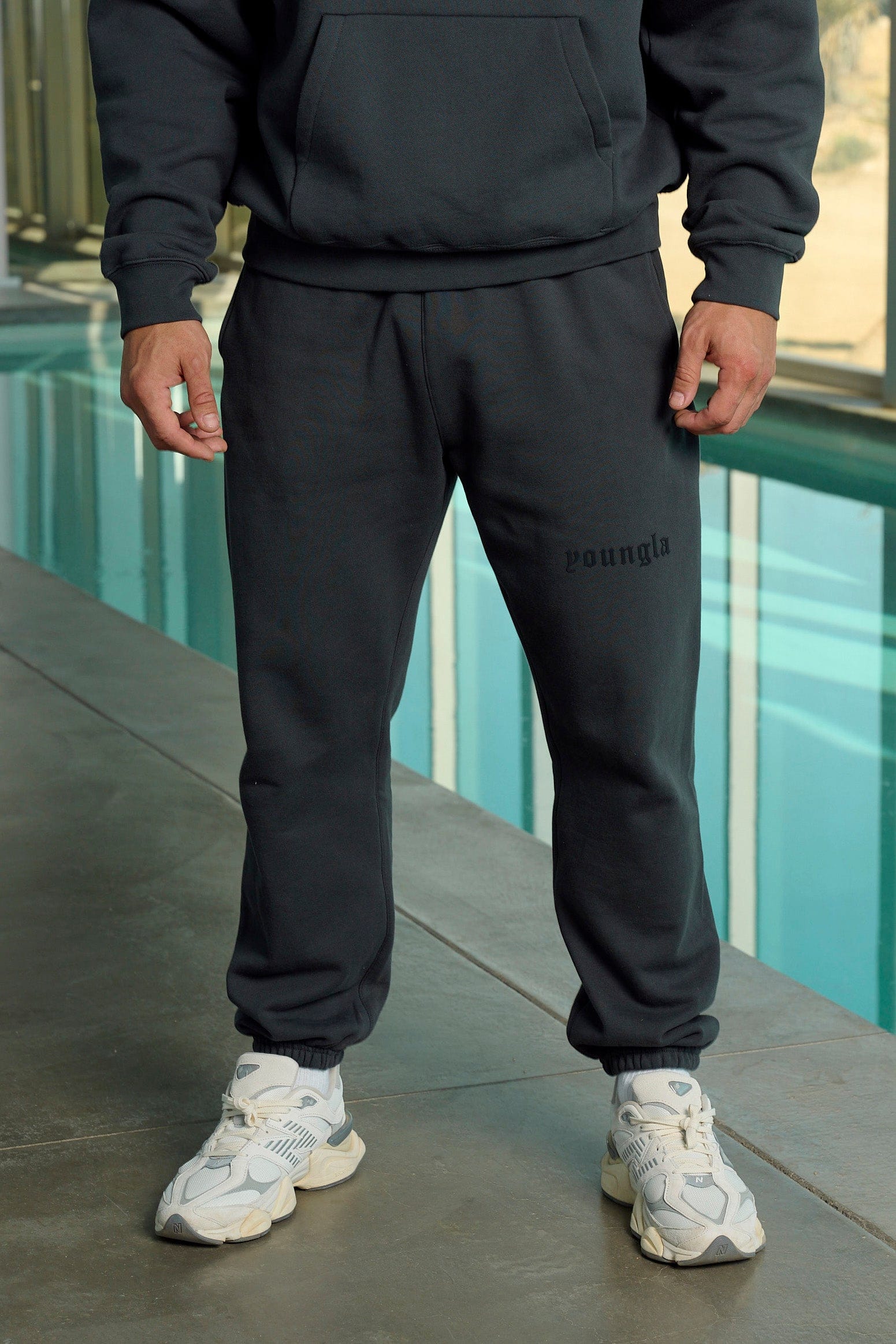 Model wearing Nike mens tech fleece joggers, highlighting their comfort and style.