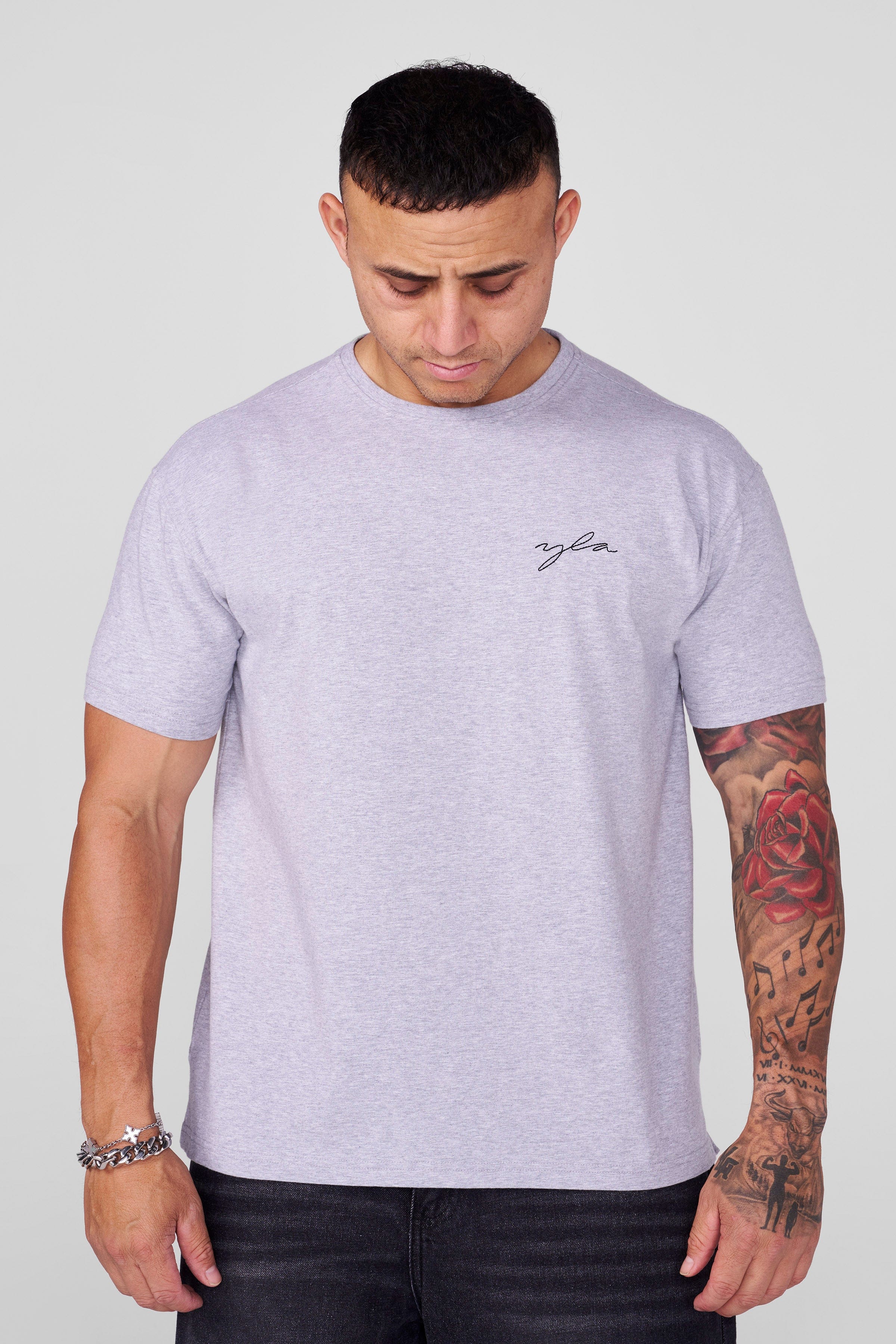 Front view of the slim fit t shirt on model, styled for fall layering