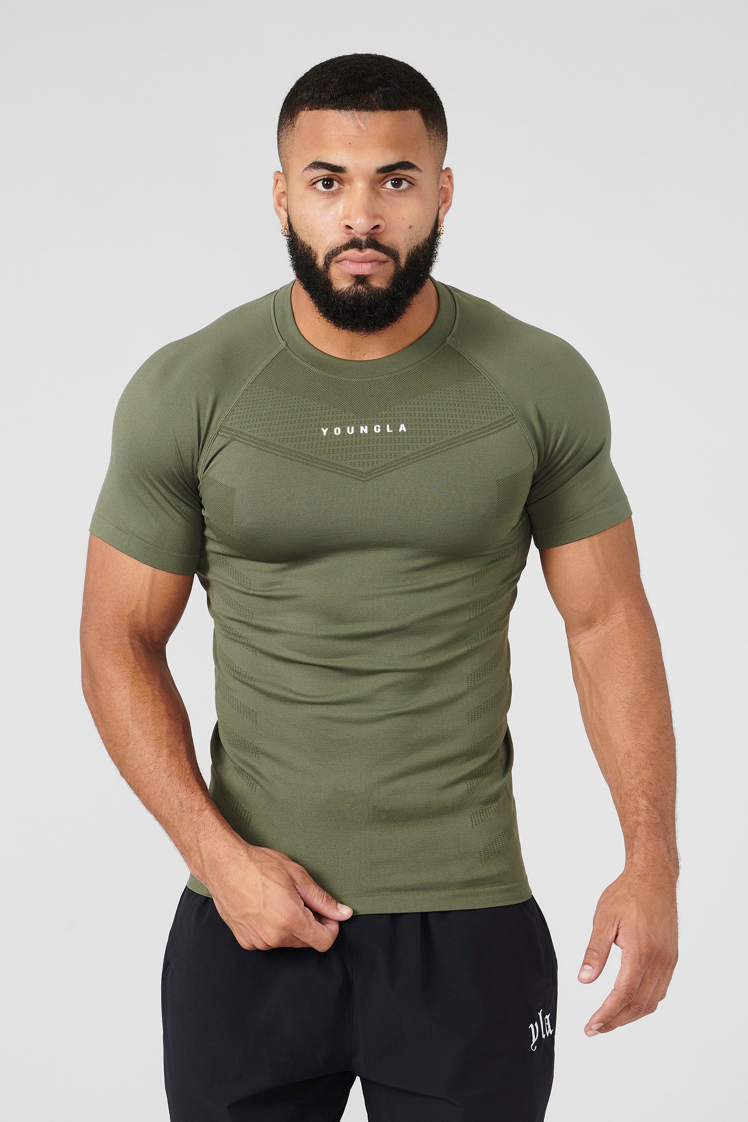 Man jogging outdoors in SuperVillain long sleeve workout shirt.