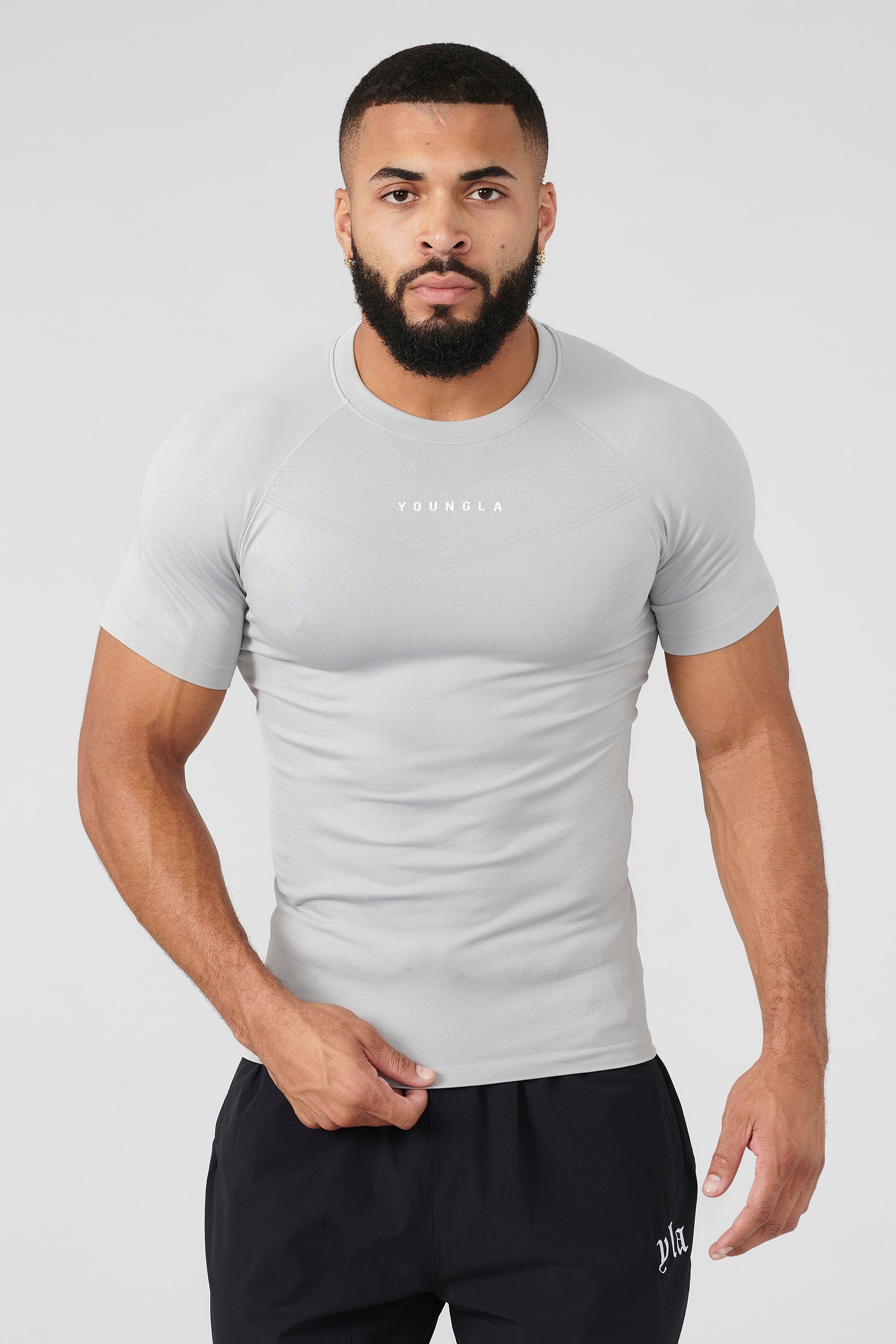Man jogging outdoors in SuperVillain long sleeve workout shirt.