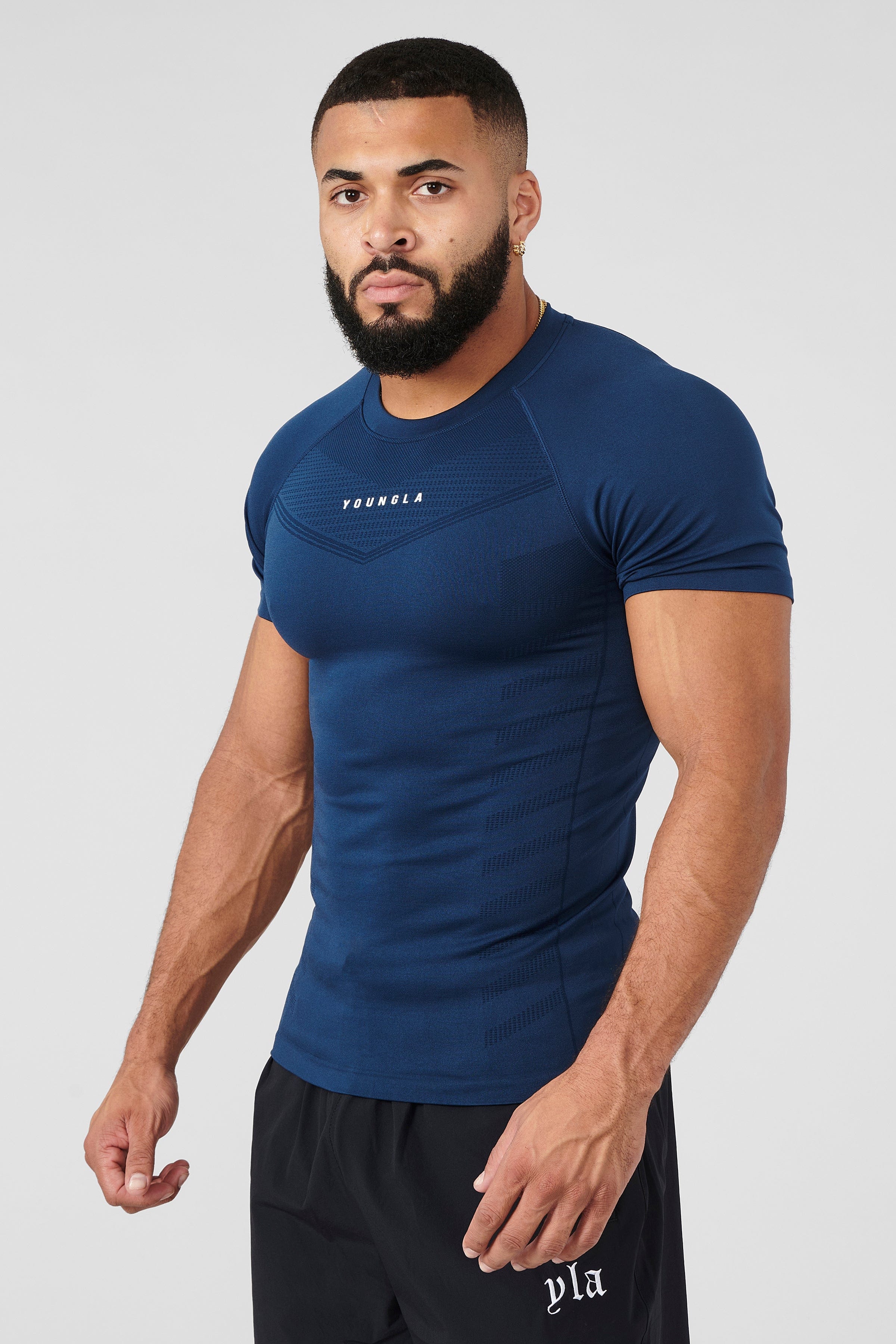 Close-up of fabric texture of SuperVillain fitness compression tees.